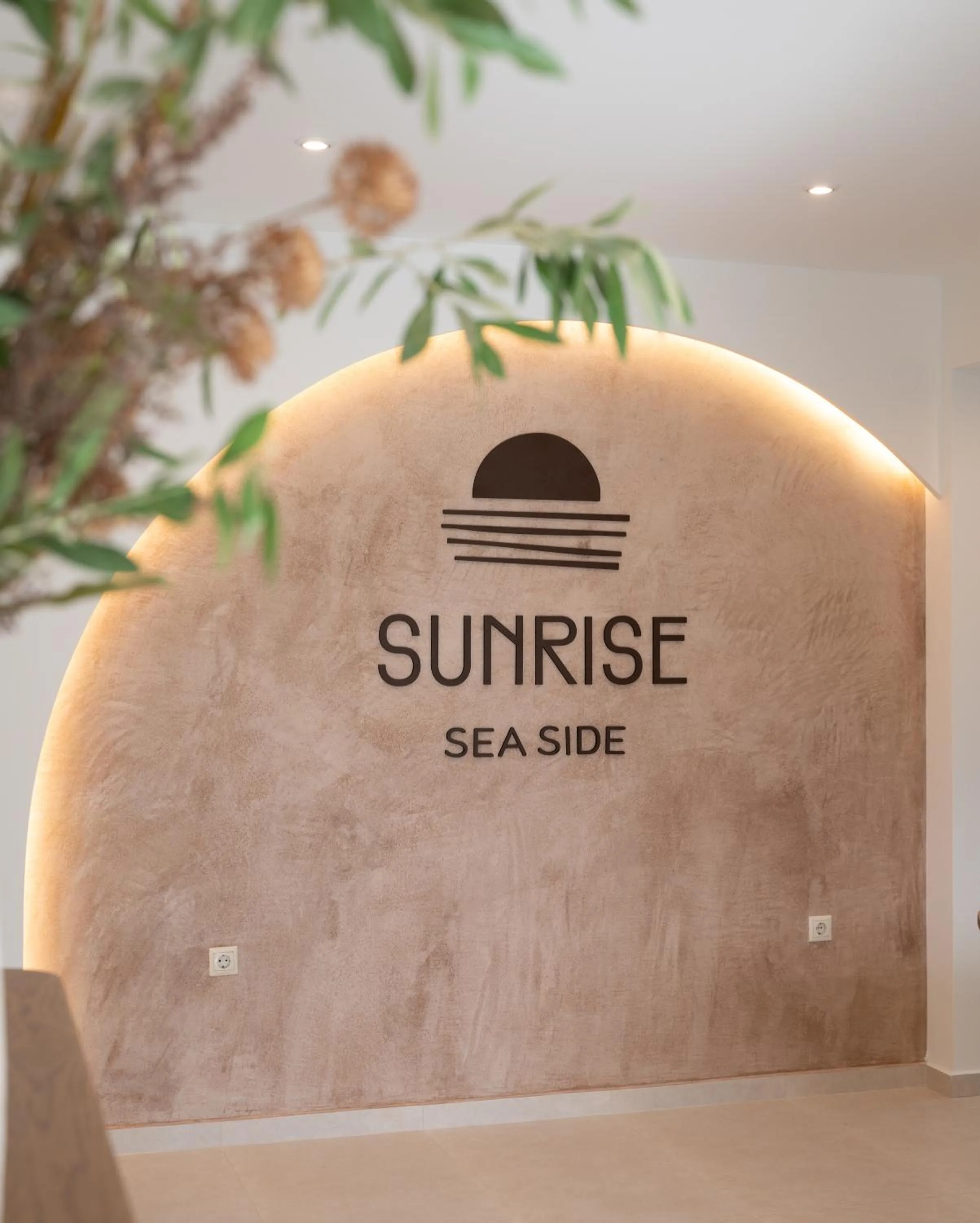 Property logo or sign in Sunrise SeaSide Suites