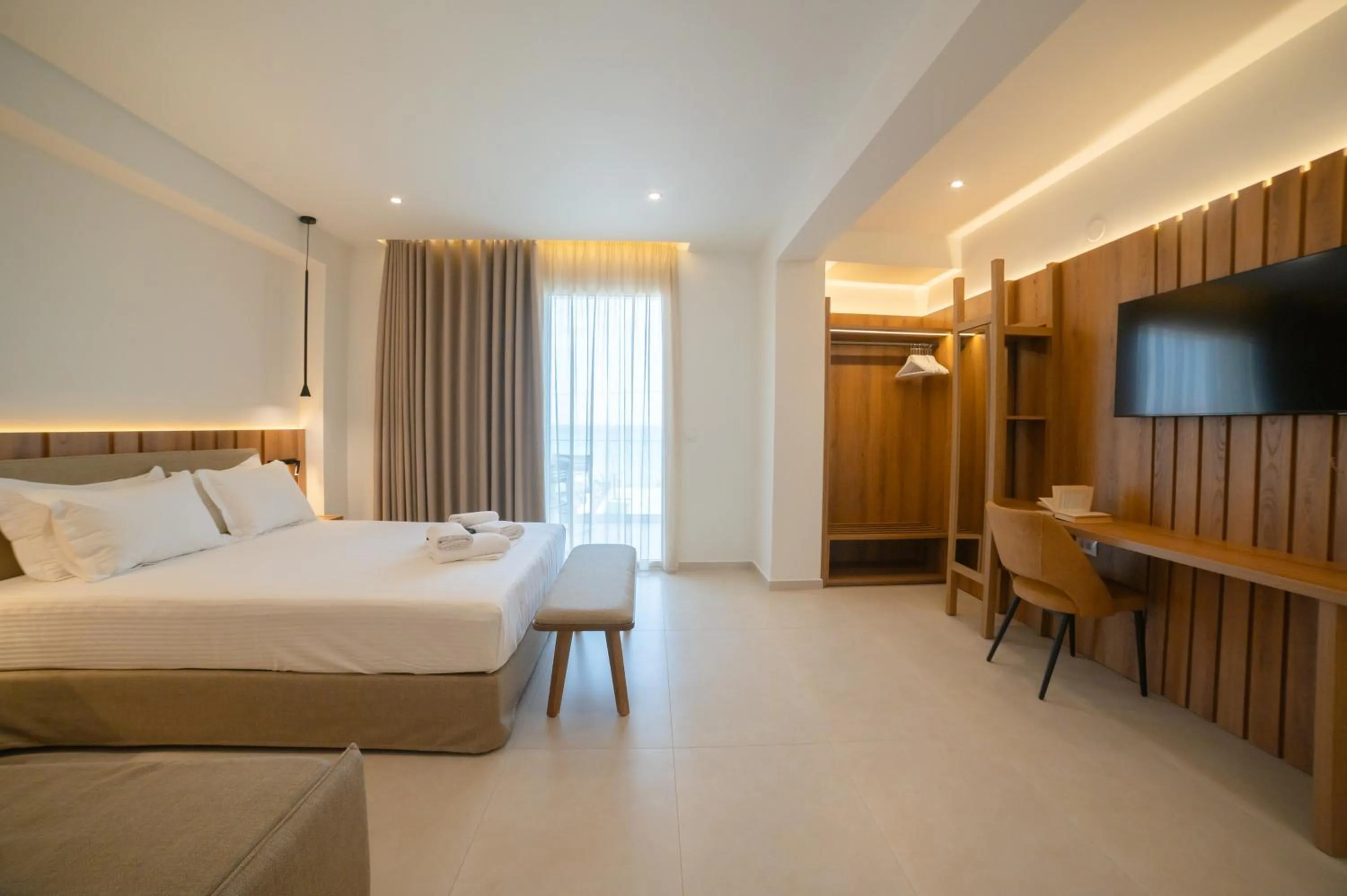 Bed in Sunrise SeaSide Suites