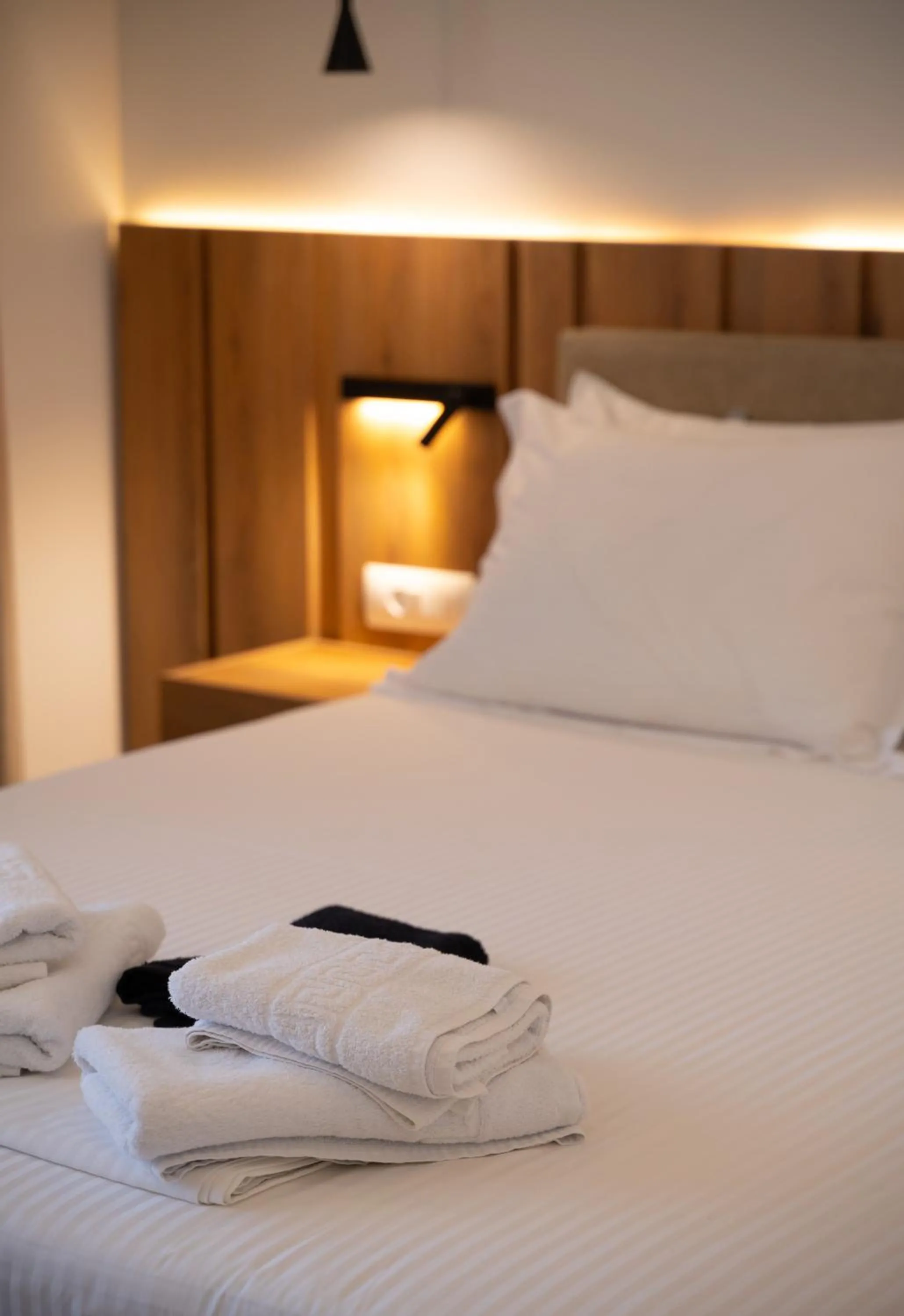Bed in Sunrise SeaSide Suites