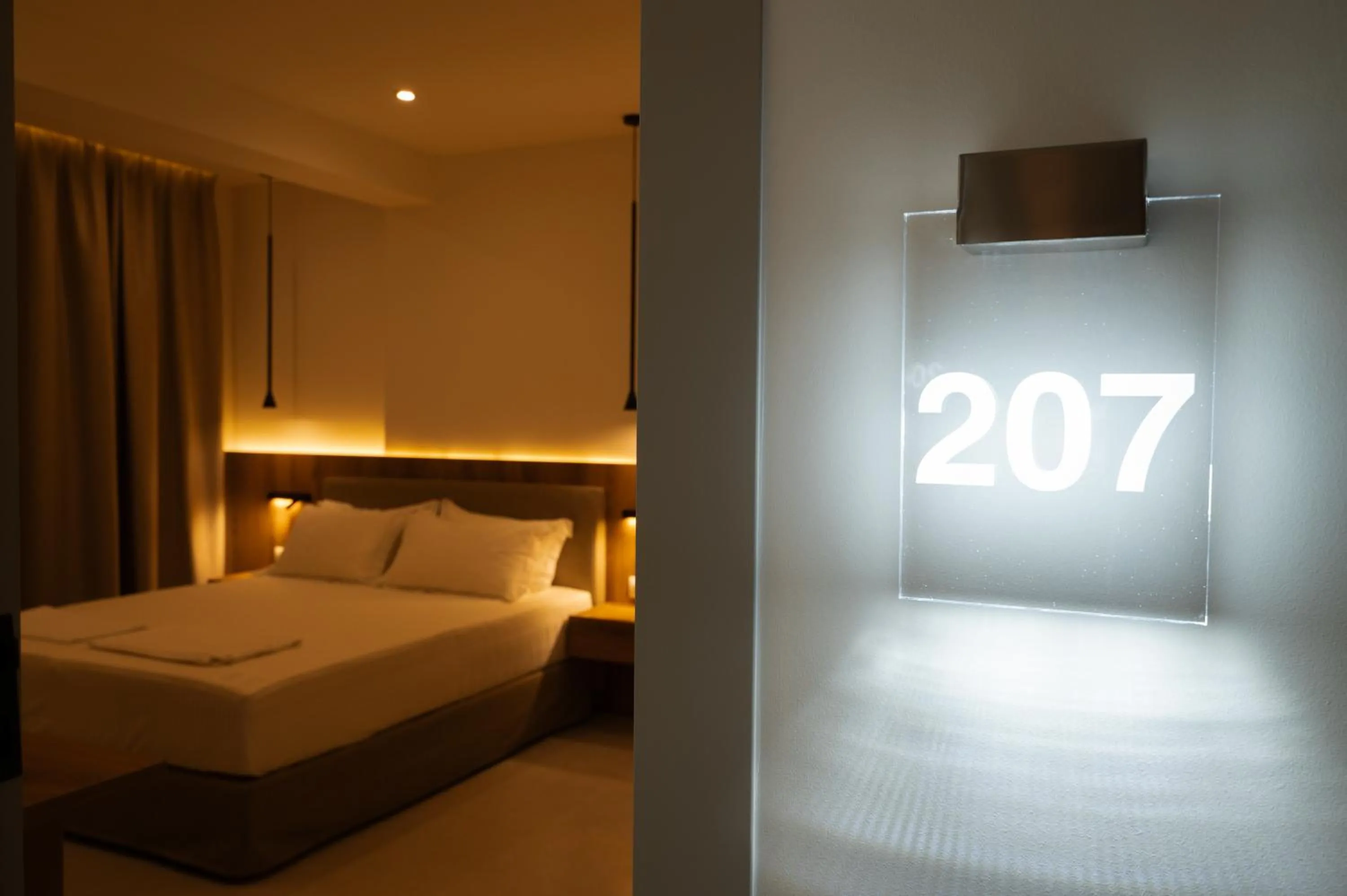 Bed in Sunrise SeaSide Suites