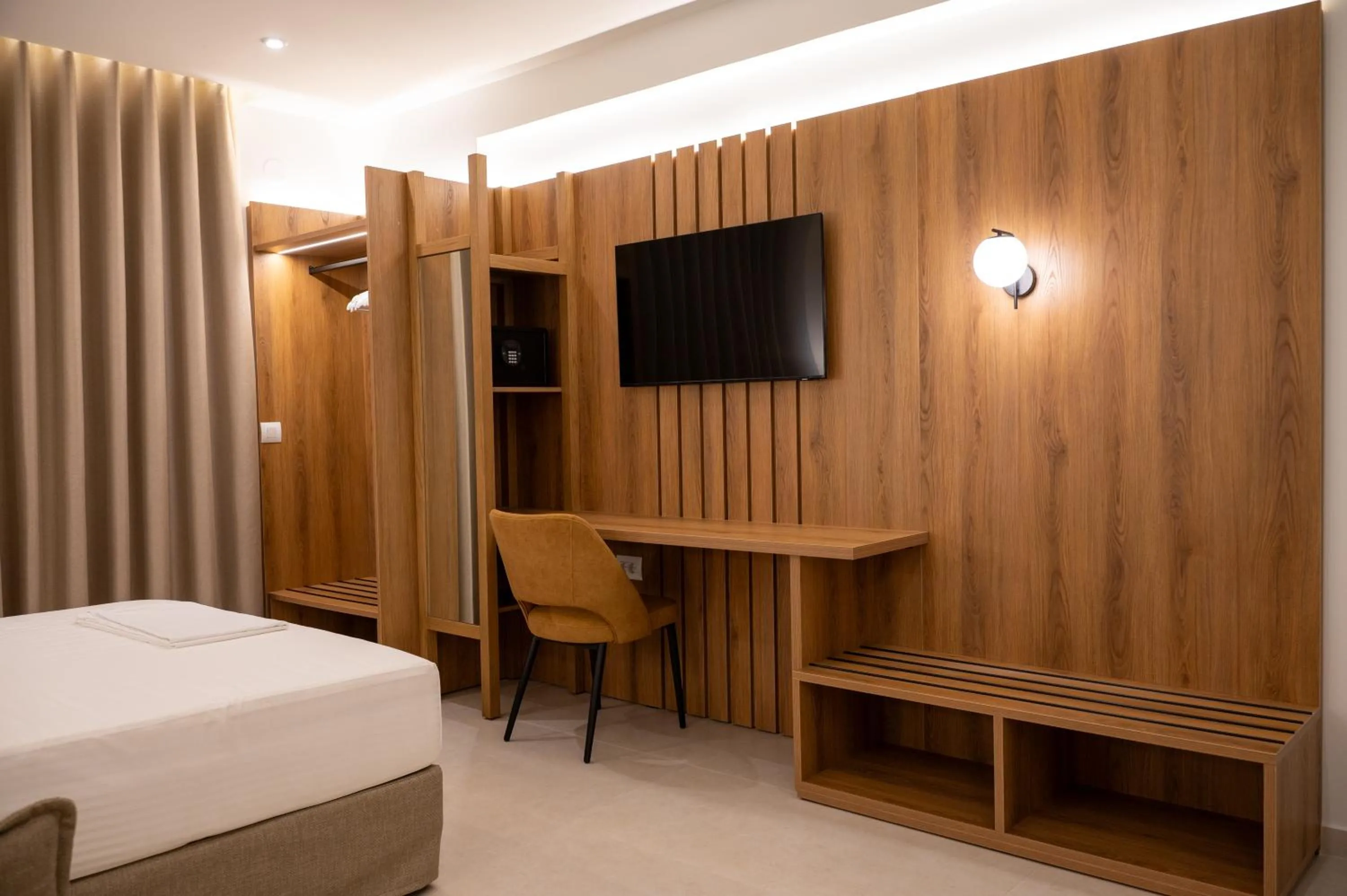 Bed in Sunrise SeaSide Suites