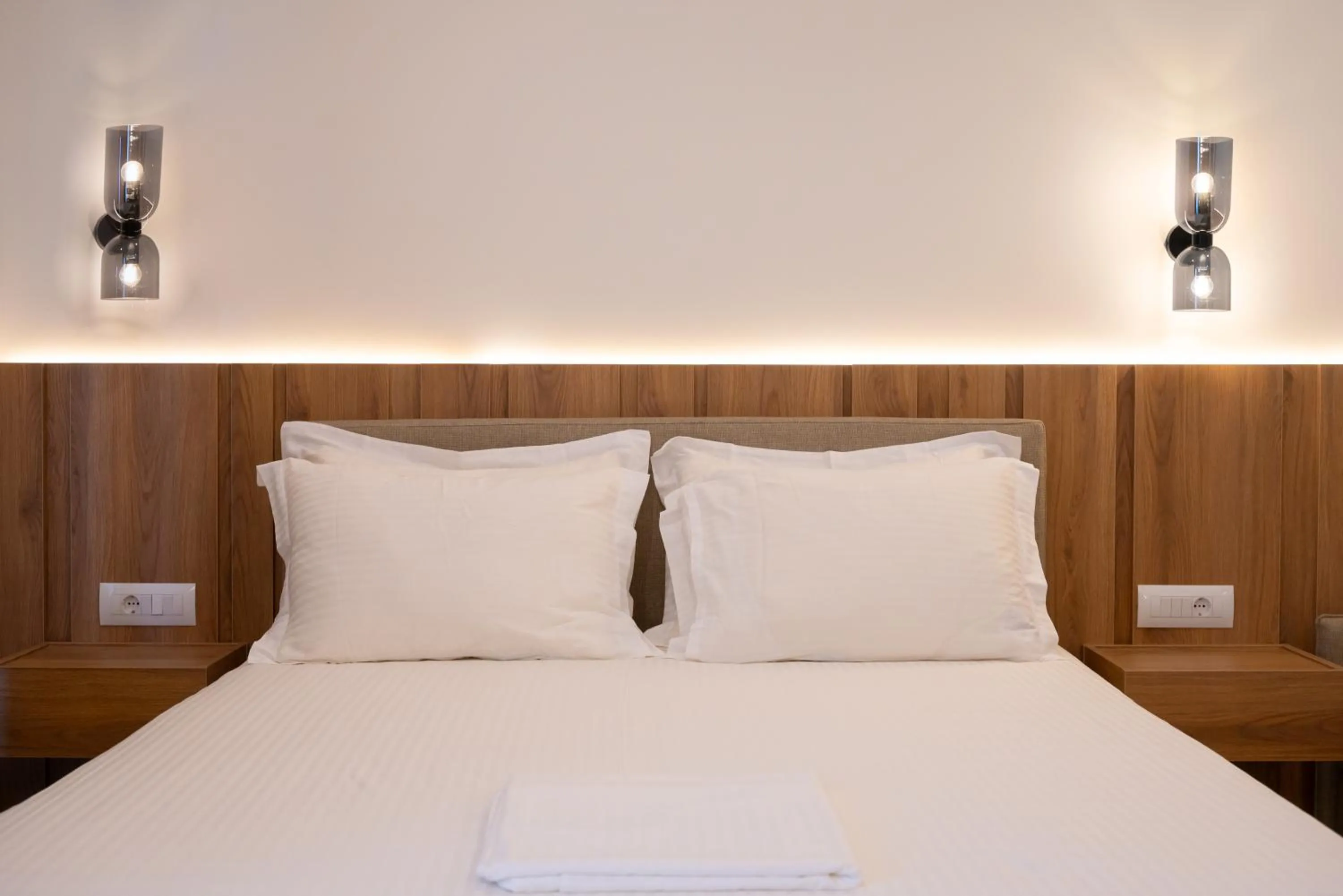 Bed in Sunrise SeaSide Suites