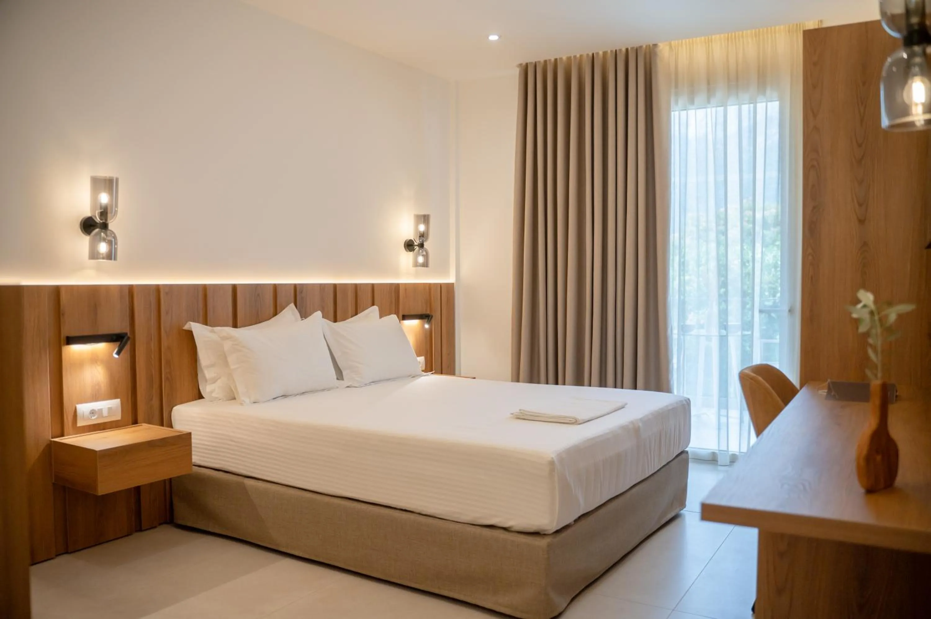 Bed in Sunrise SeaSide Suites