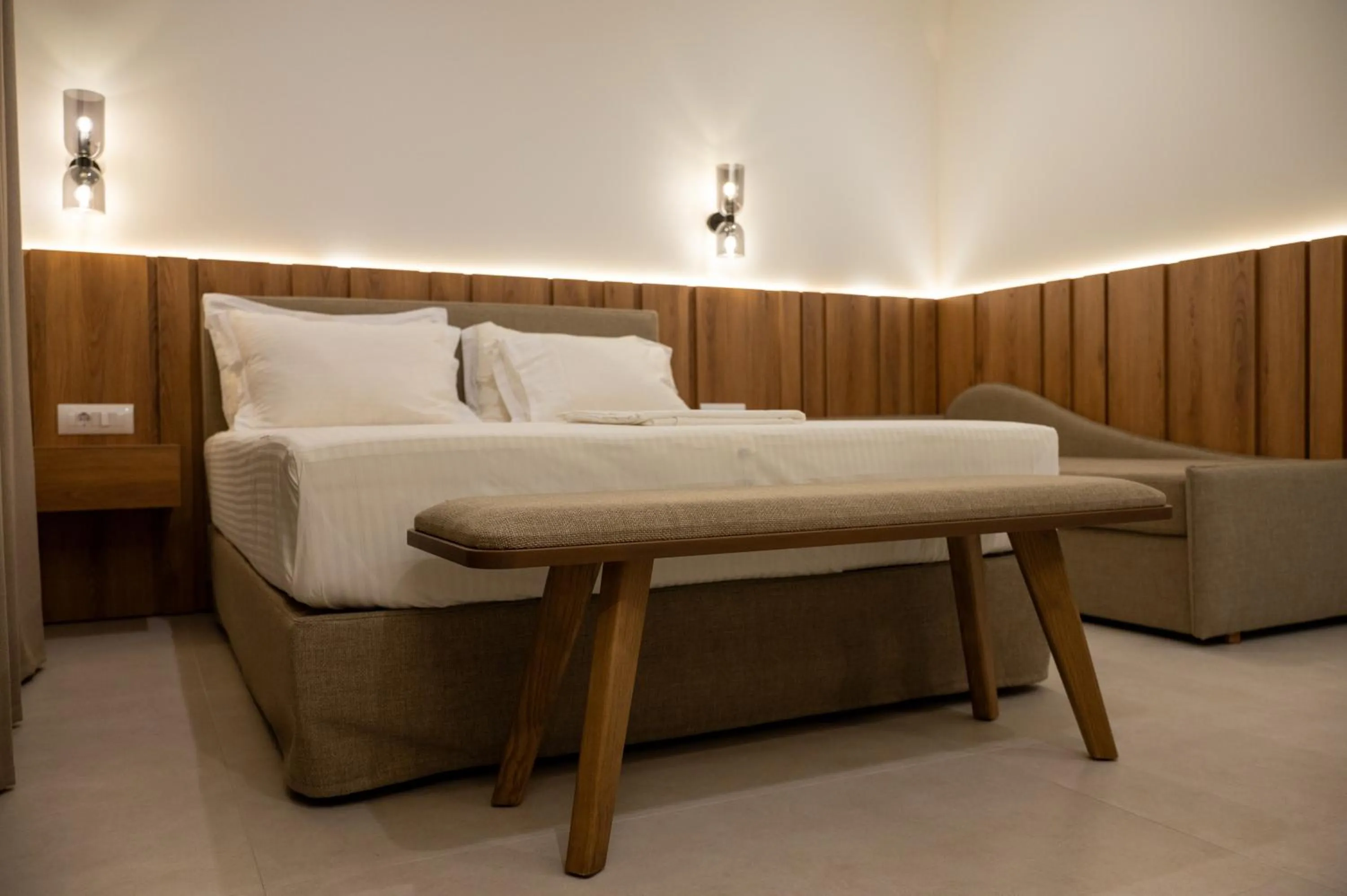 Bed in Sunrise SeaSide Suites