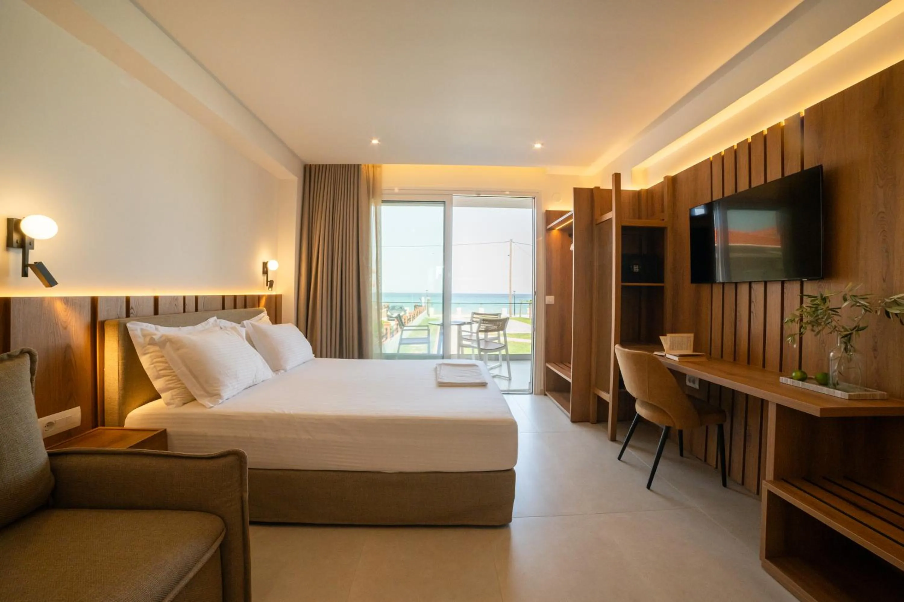 Bed in Sunrise SeaSide Suites