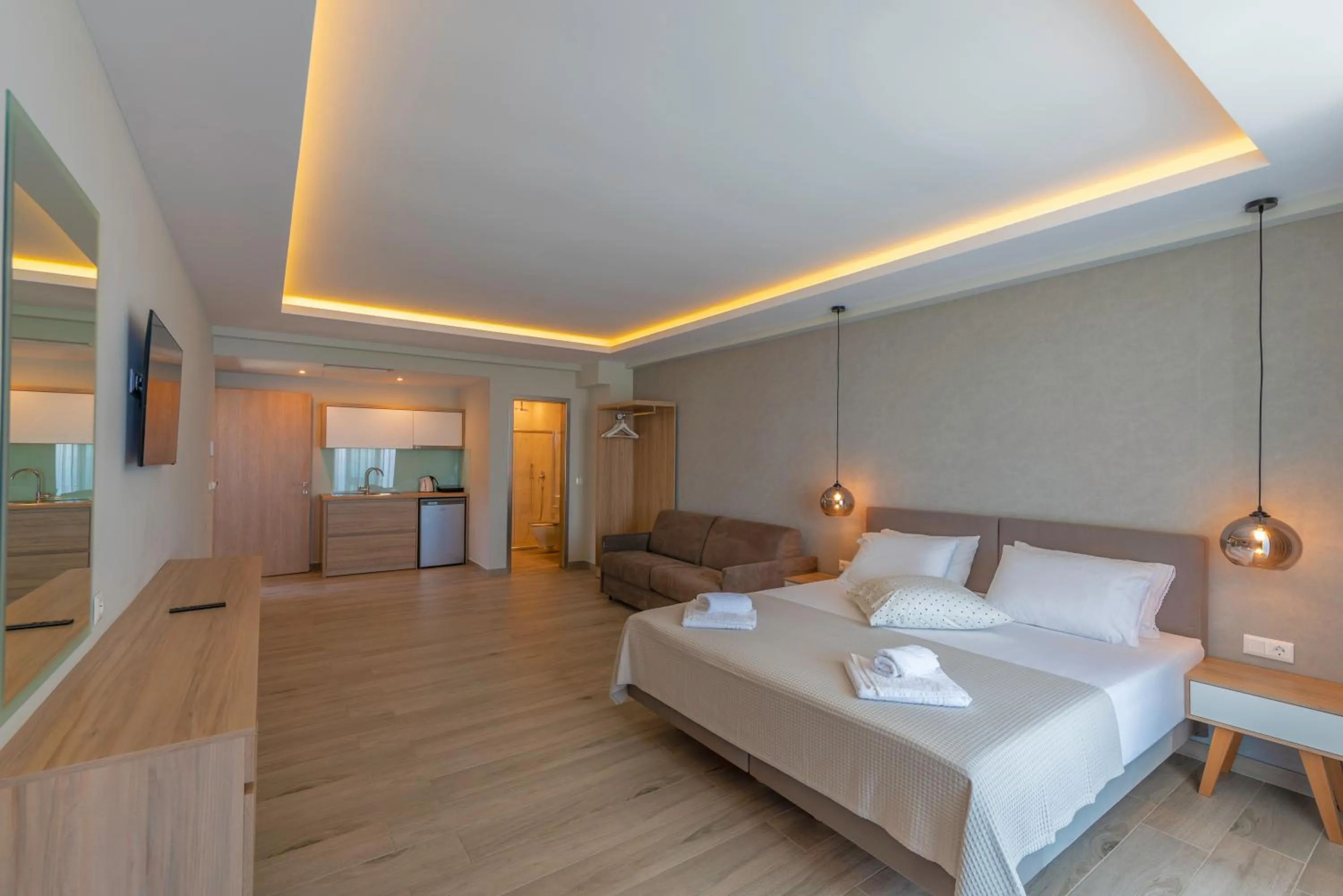 Bed in Sunrise SeaSide Suites