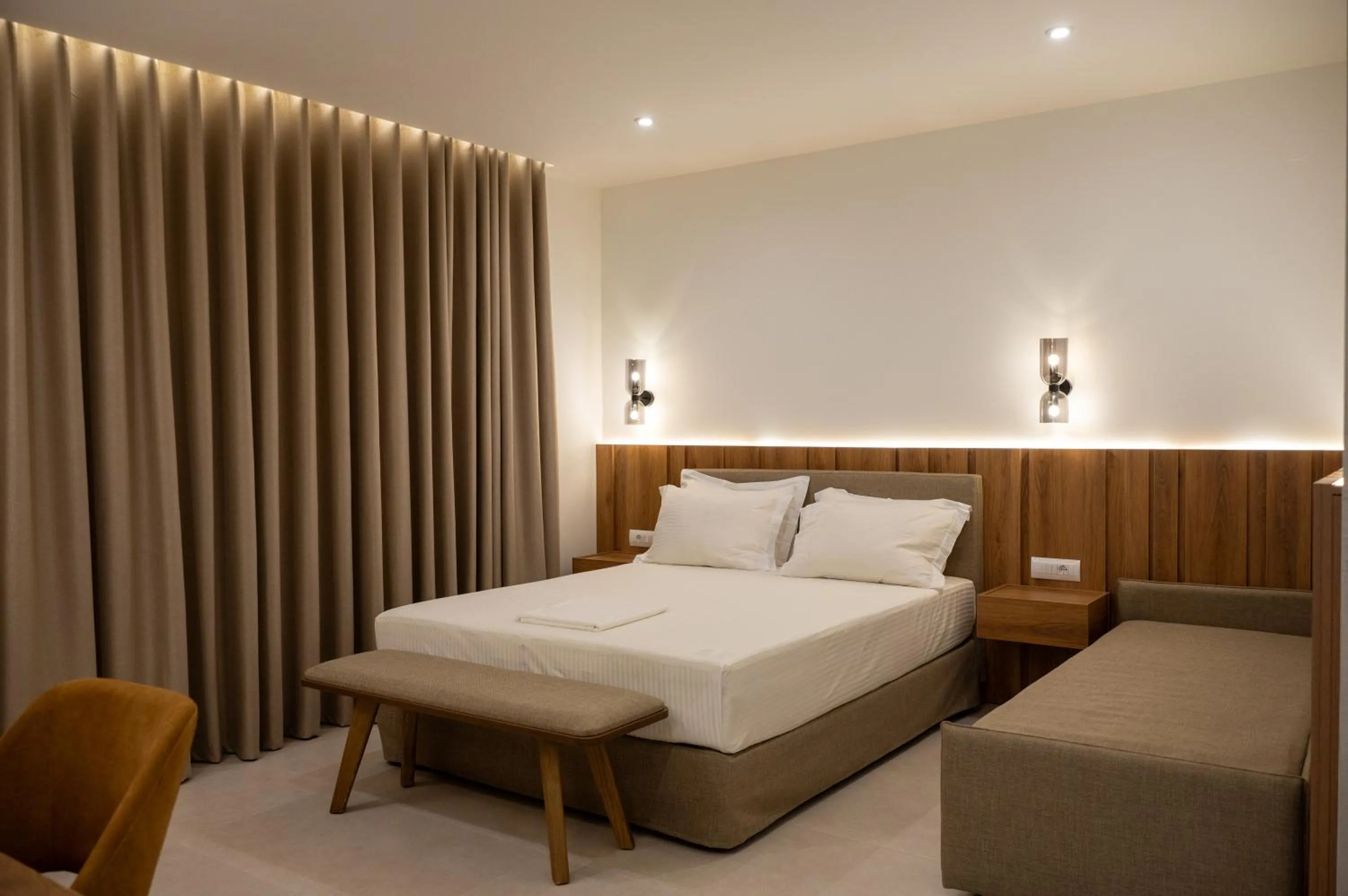 Bed in Sunrise SeaSide Suites