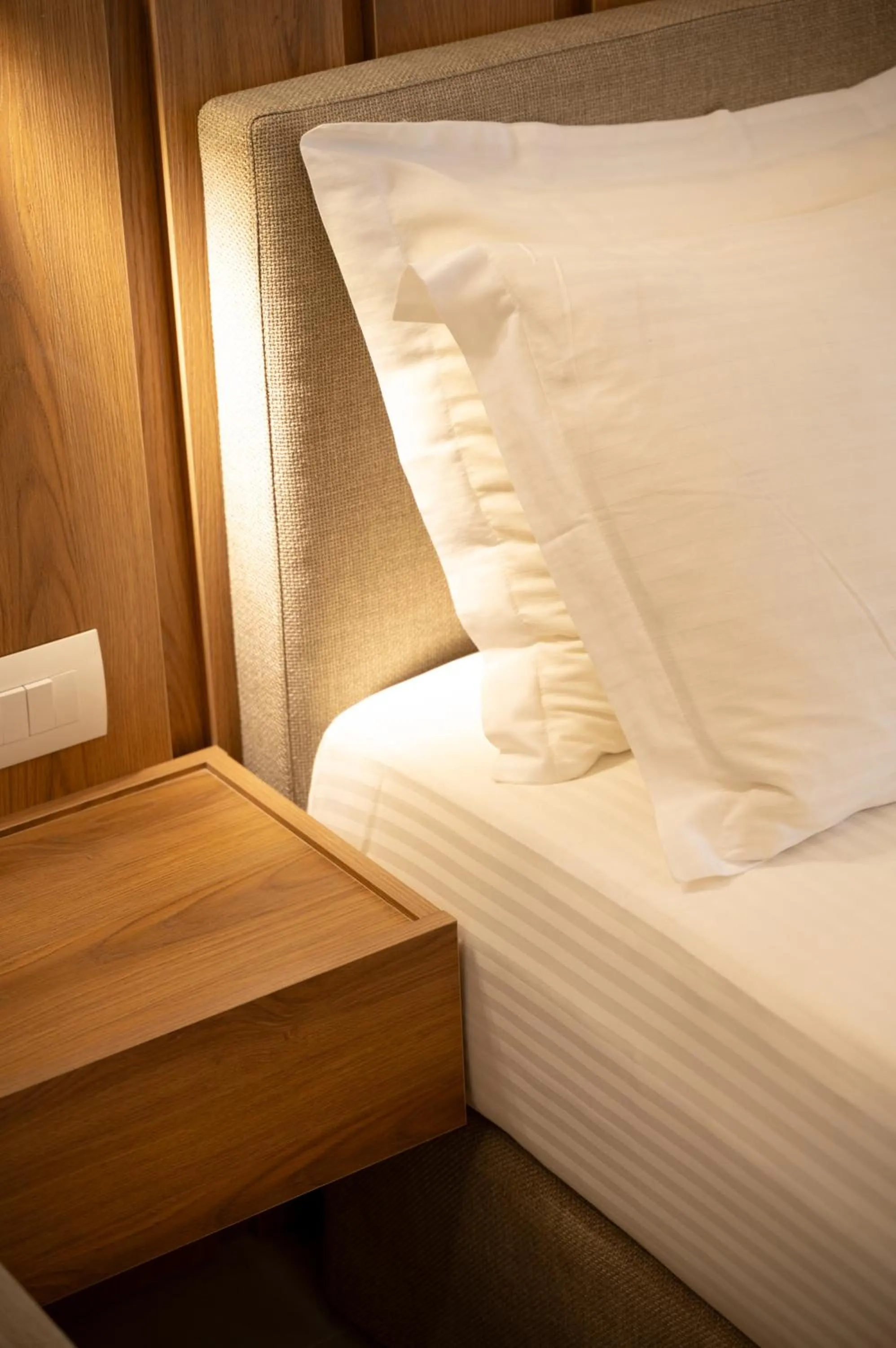 Bed in Sunrise SeaSide Suites