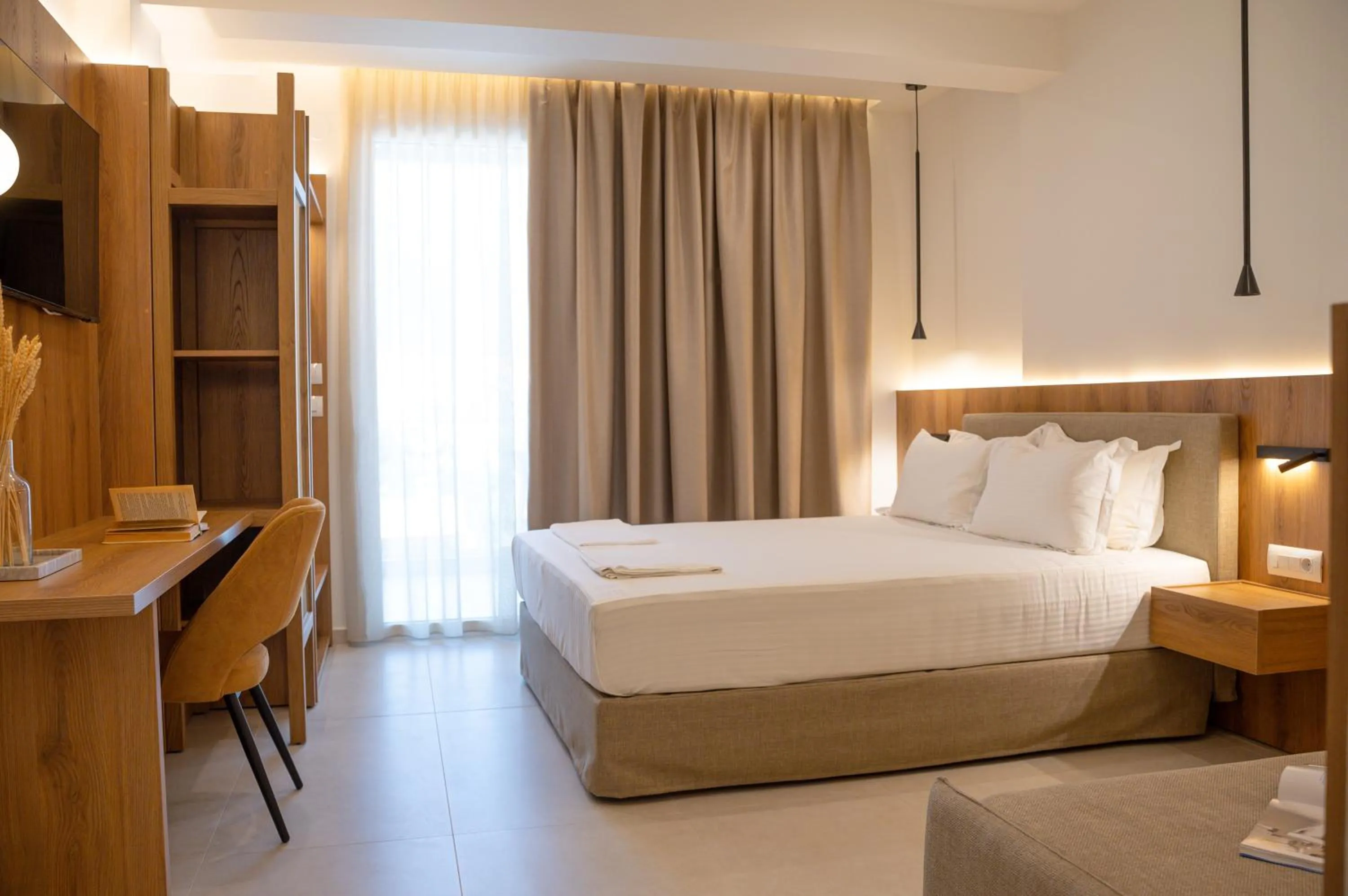 Bed in Sunrise SeaSide Suites