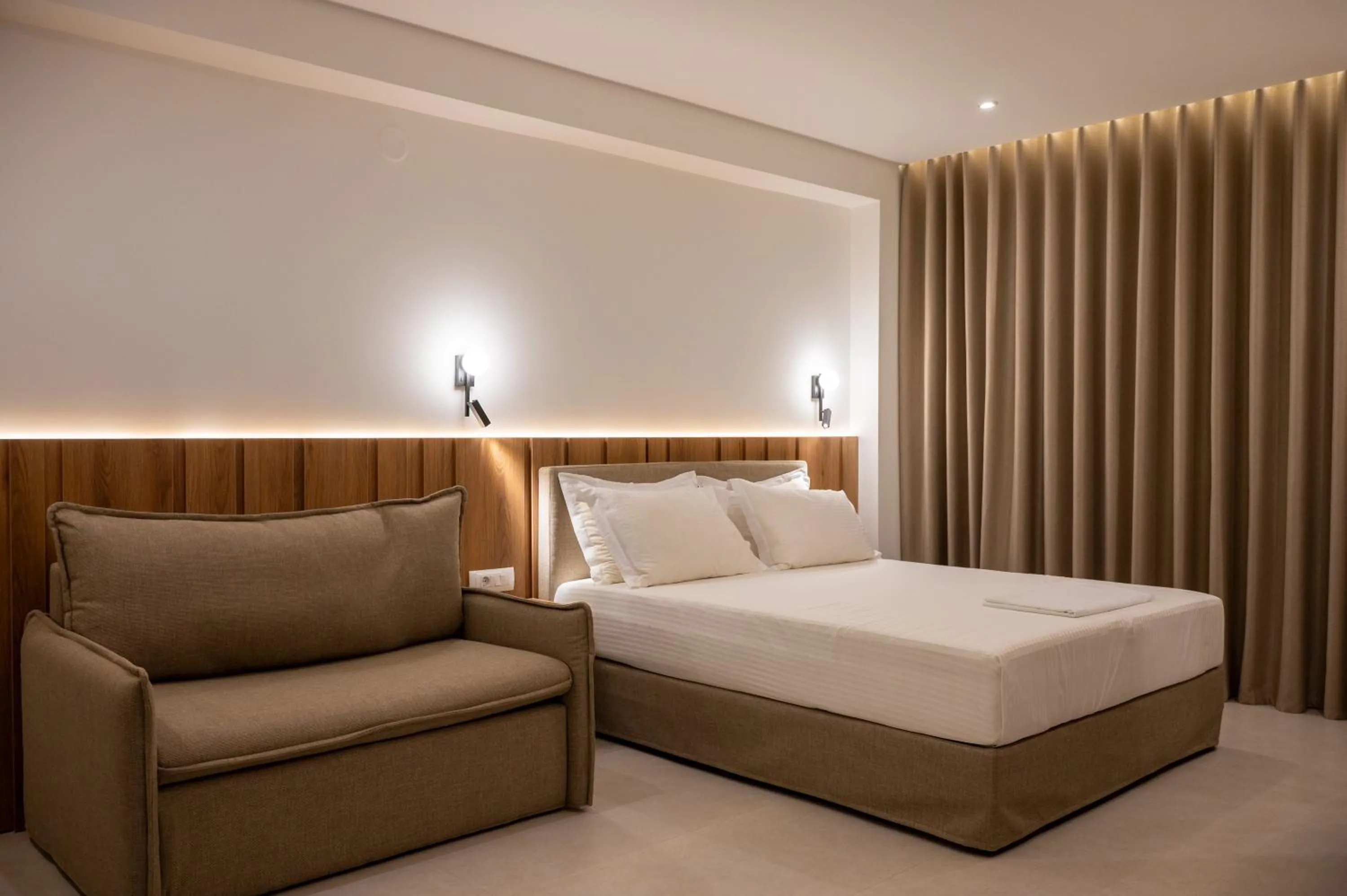 Bed in Sunrise SeaSide Suites