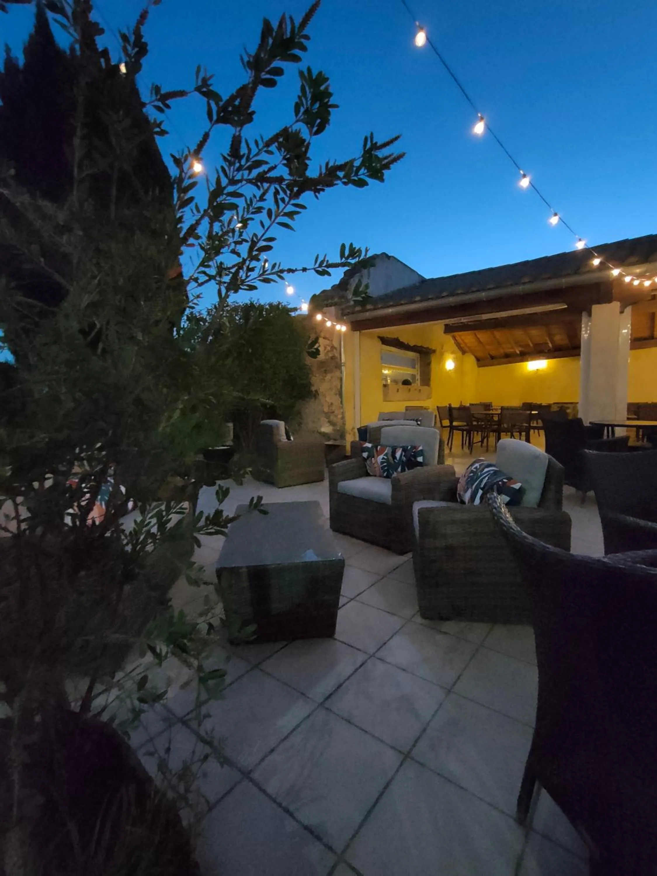 Patio in Hôtel Restaurant L'Art des Mets by Côté Jardin