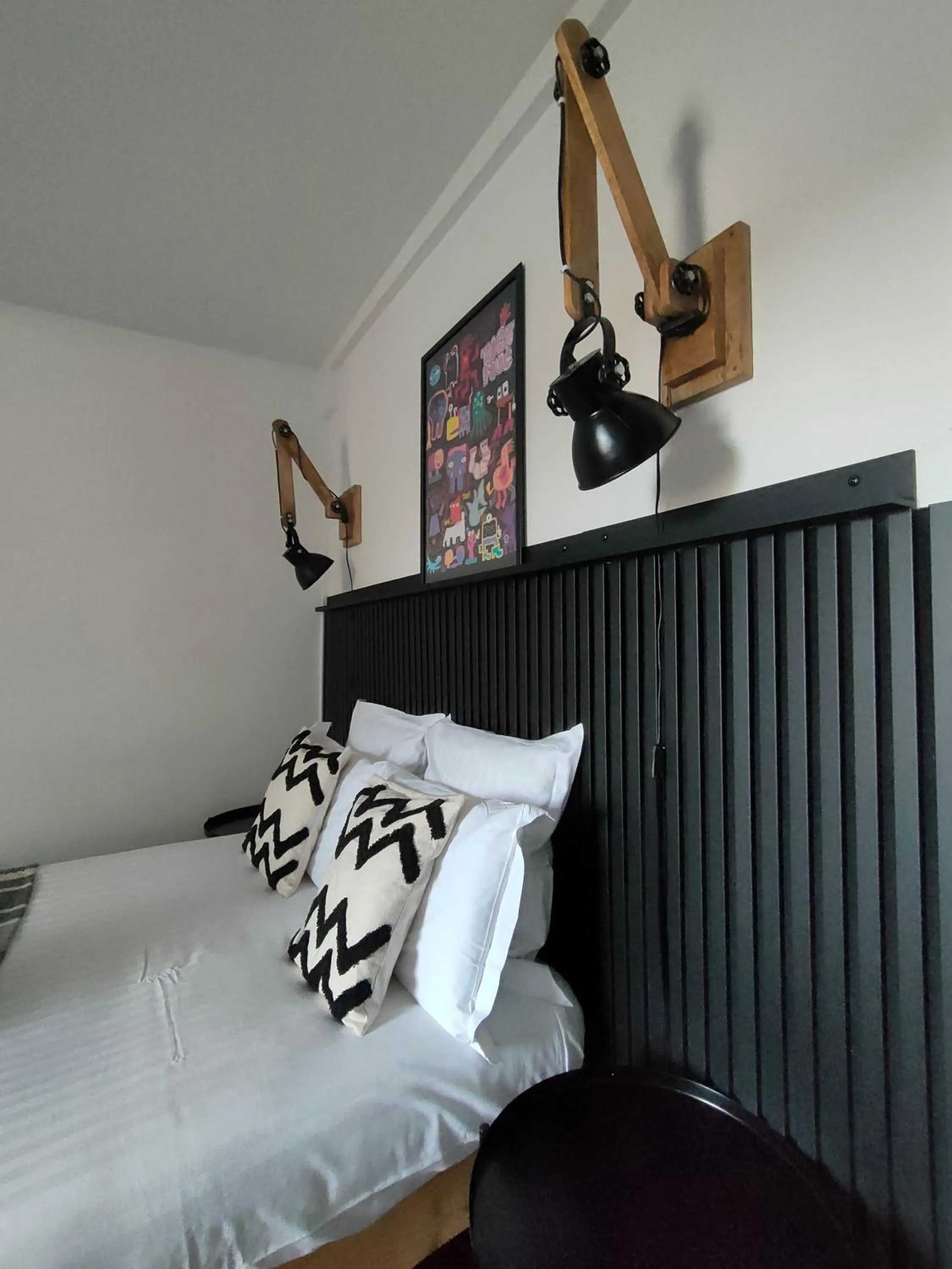 Bed in Hôtel Restaurant L'Art des Mets by Côté Jardin