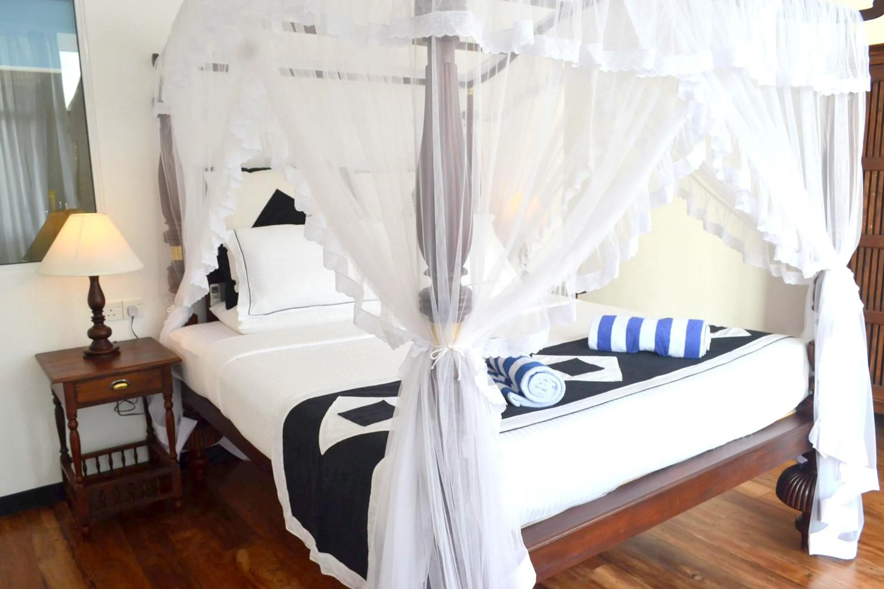 Bed in Sea World Boutique Hotel