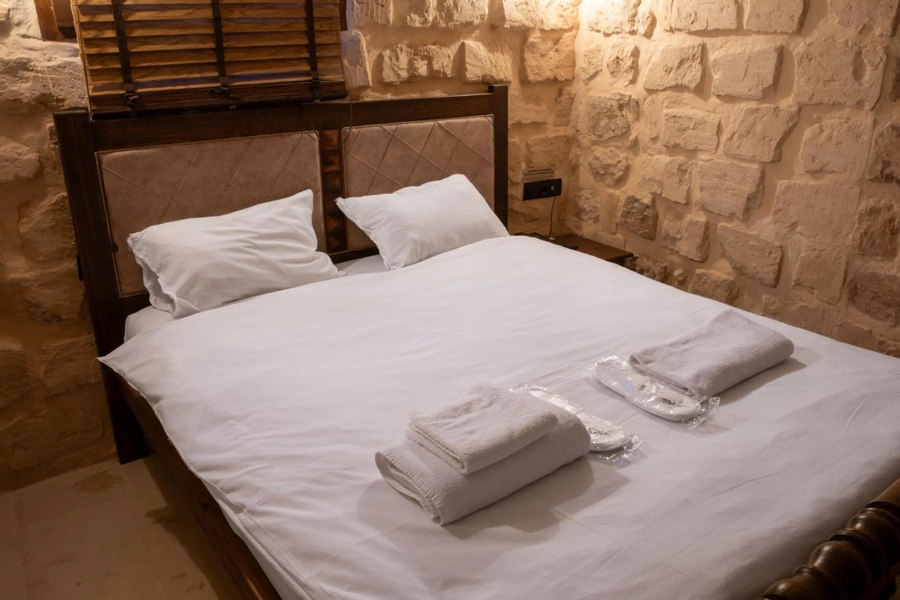 Bed in Marvel Hotel Mardin