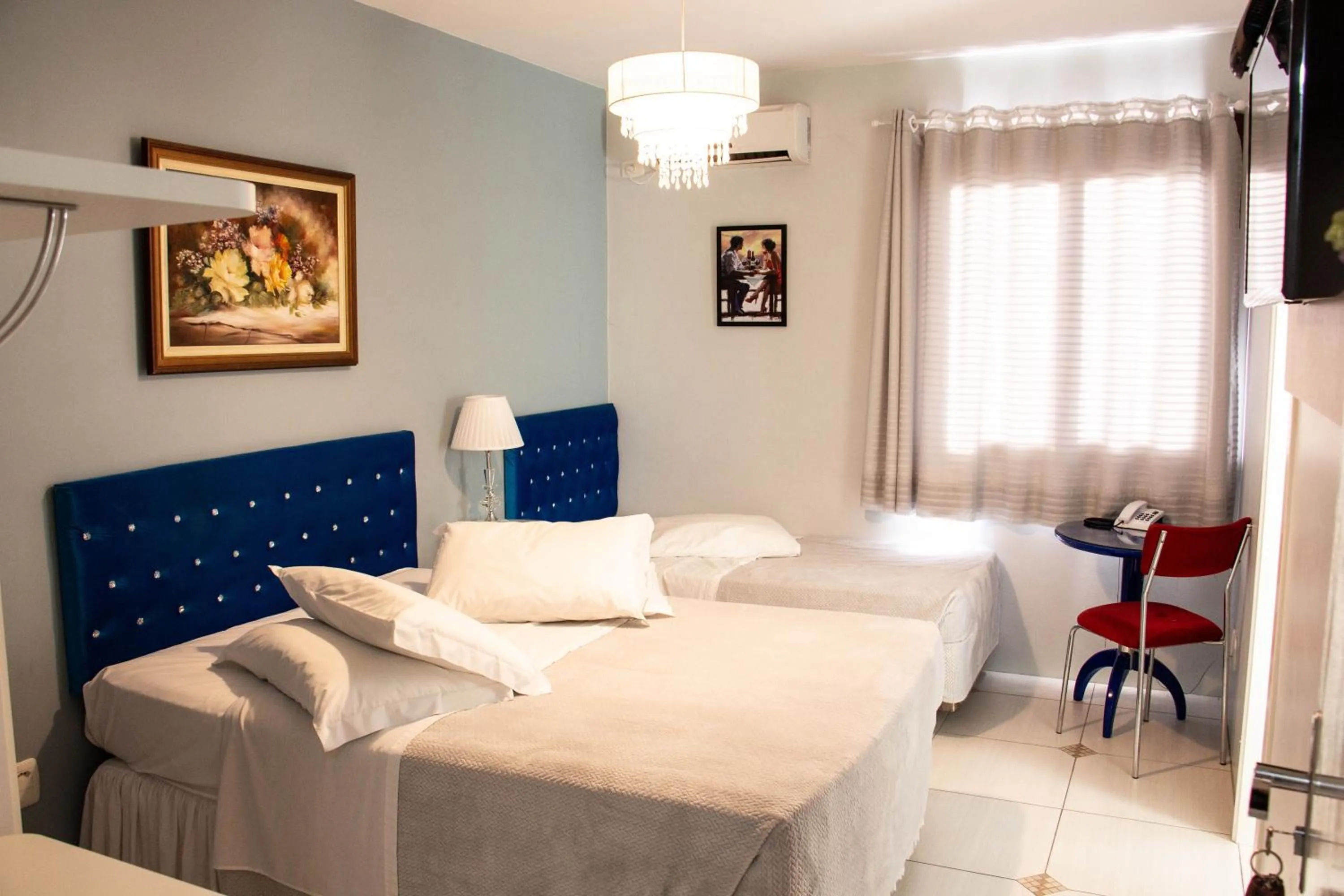 Bed in Hotel Imigrantes