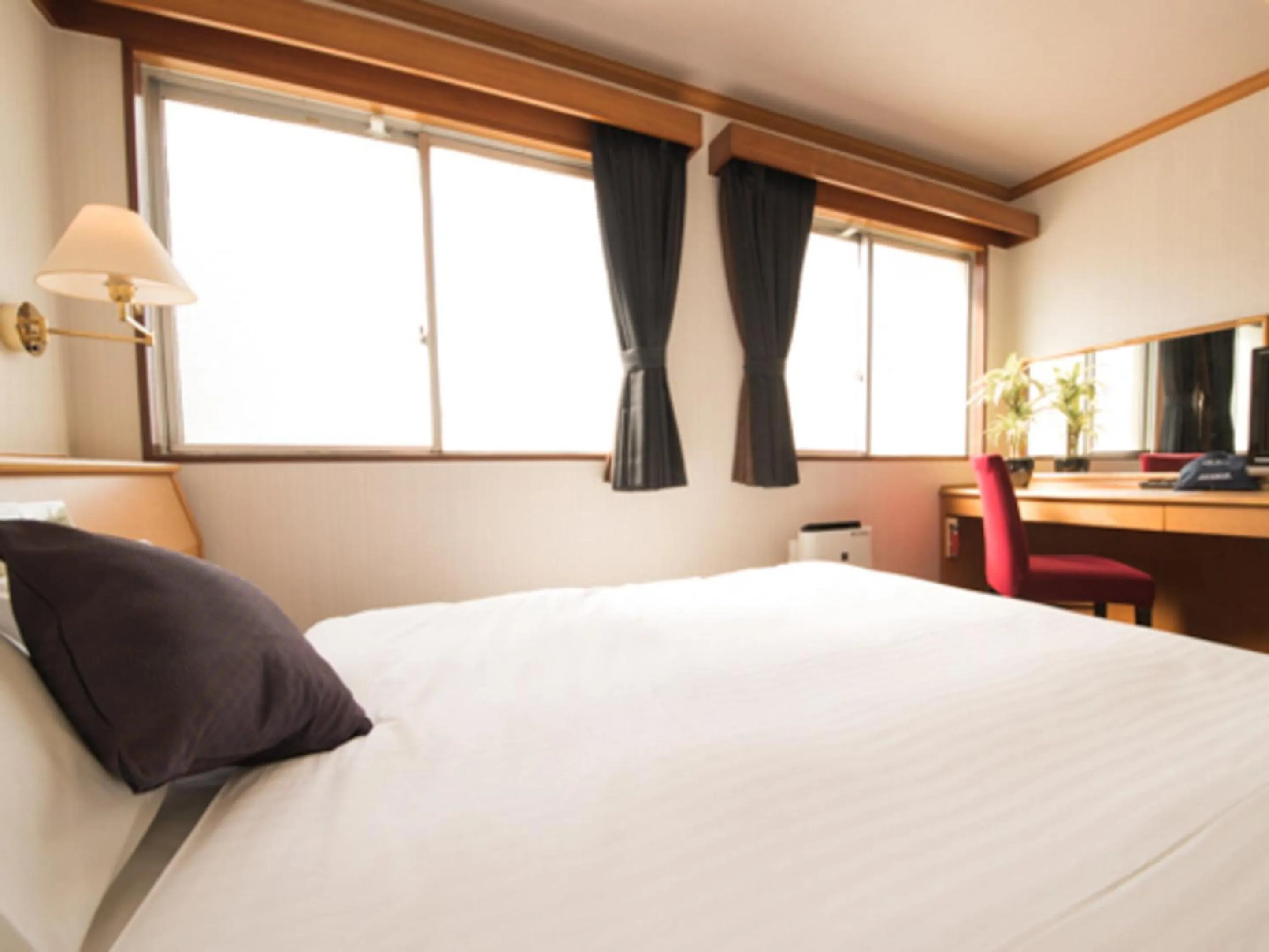 Bed in HOTEL LiVEMAX BUDGET Okinawa Tomariko