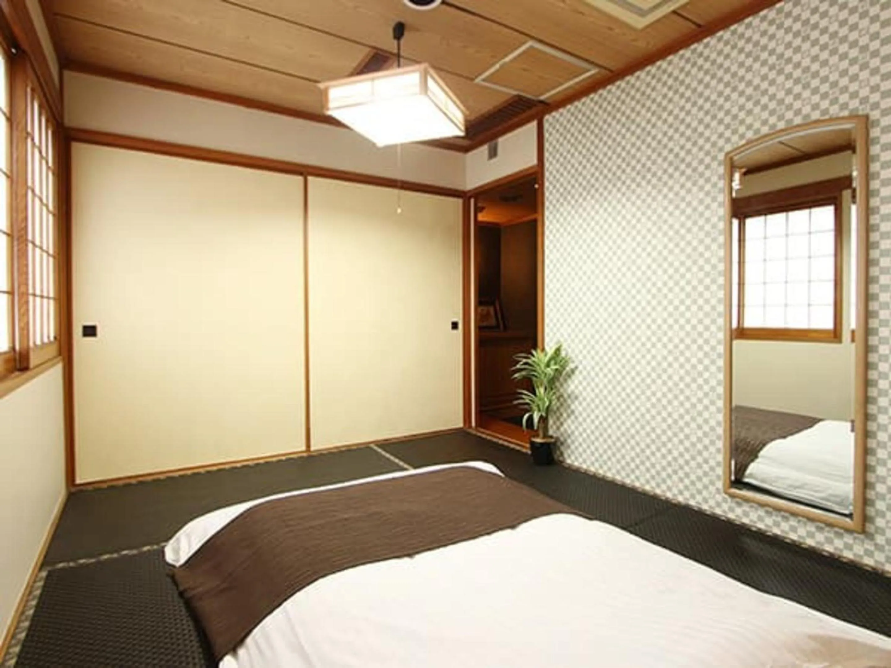 Bed in HOTEL LiVEMAX BUDGET Okinawa Tomariko