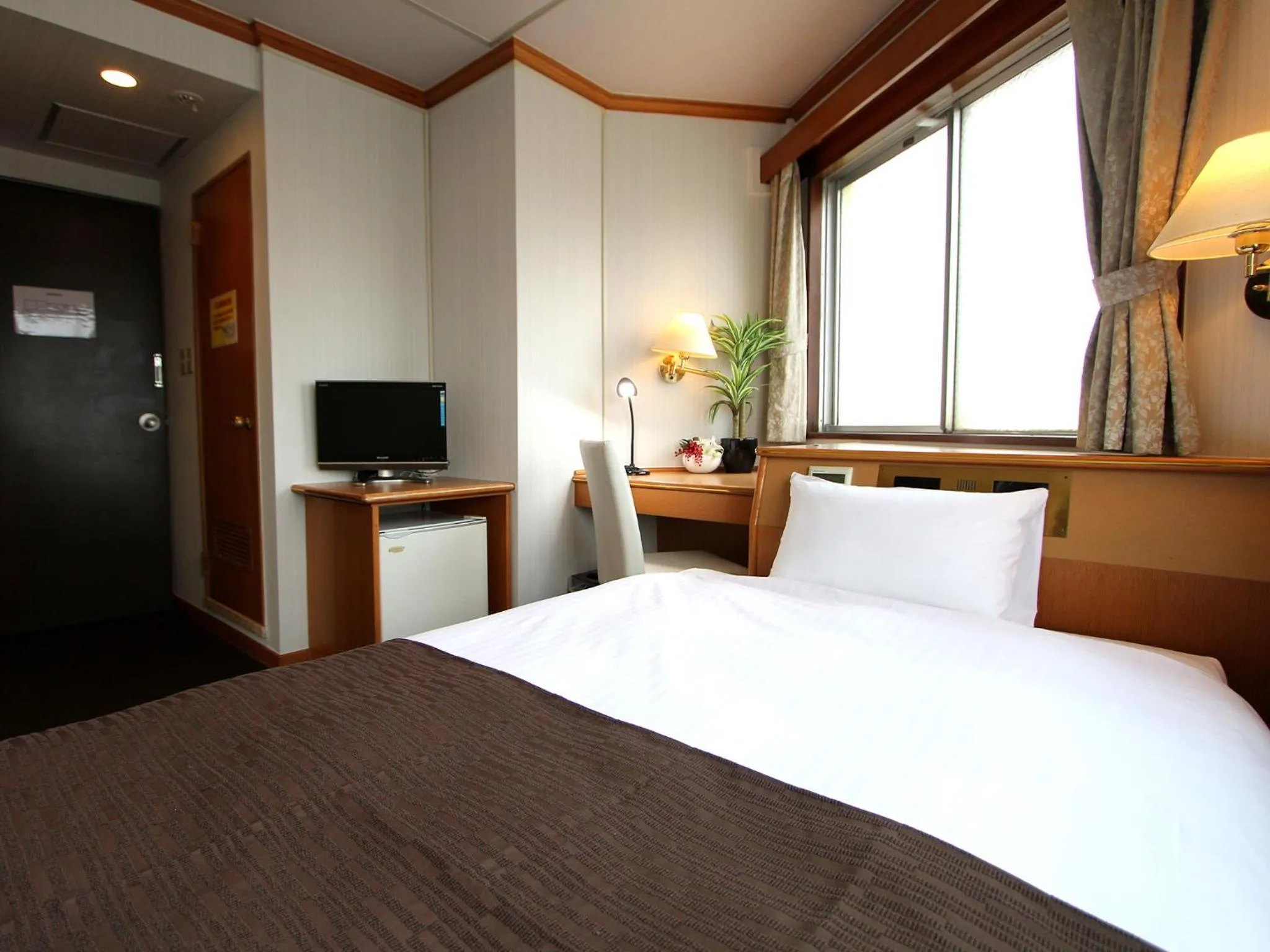 Photo of the whole room in HOTEL LiVEMAX BUDGET Okinawa Tomariko