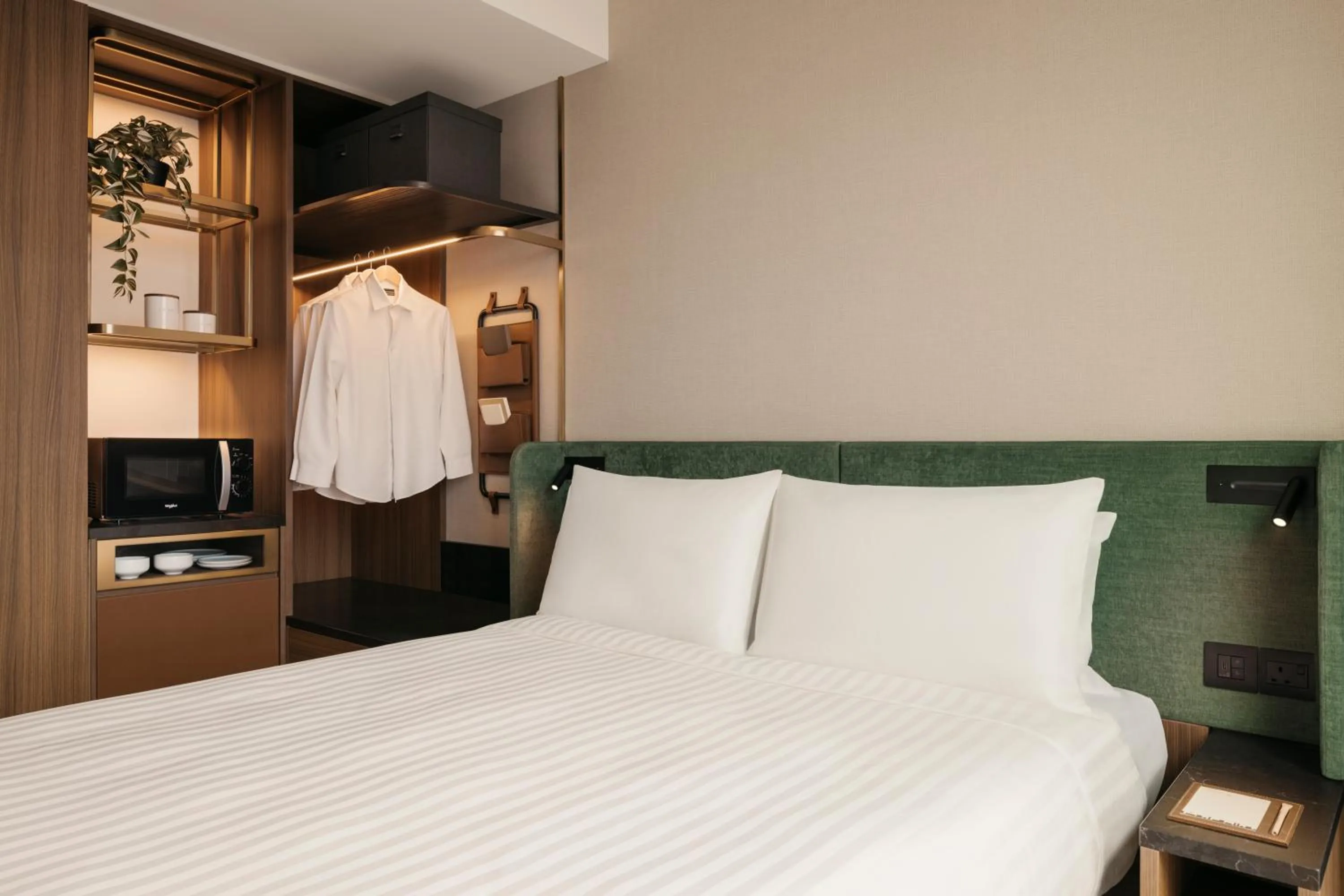 Bed in Quincy House Singapore by Far East Hospitality