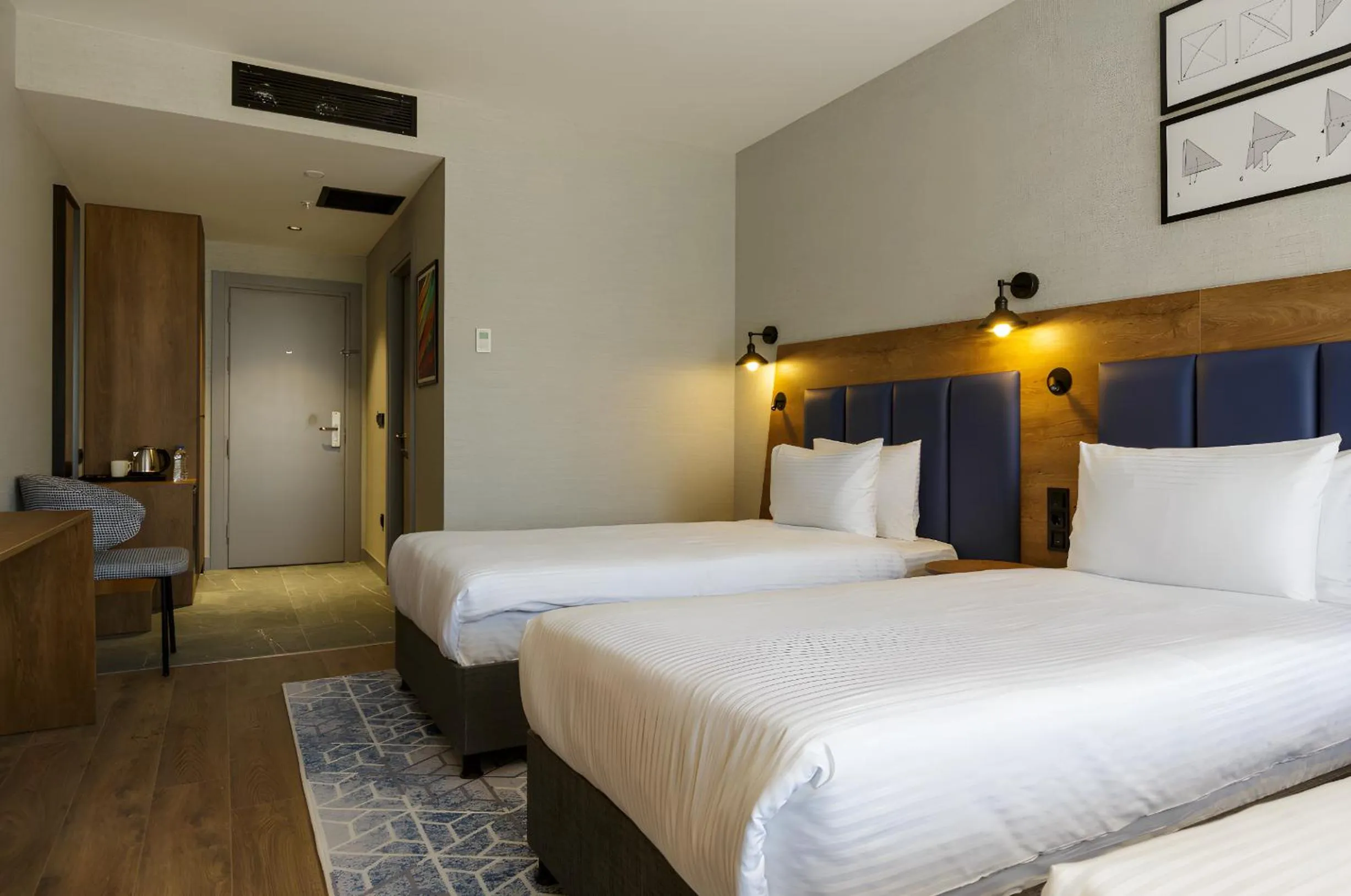 Bed in Ramada Encore by Wyndham Istanbul Arnavutkoy