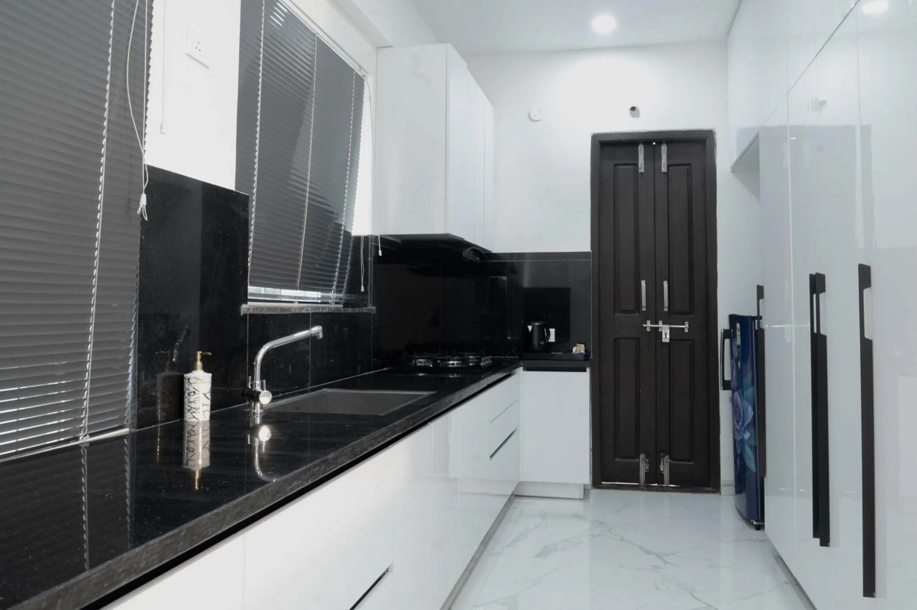 Kitchen or kitchenette in The Balcony Suites