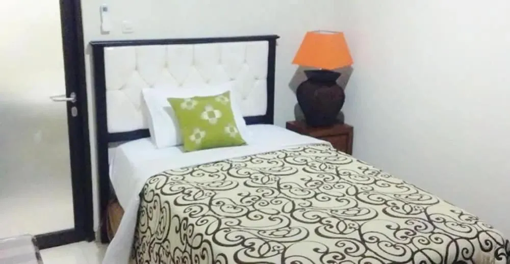 Bed in Tuban Torres Accommodation