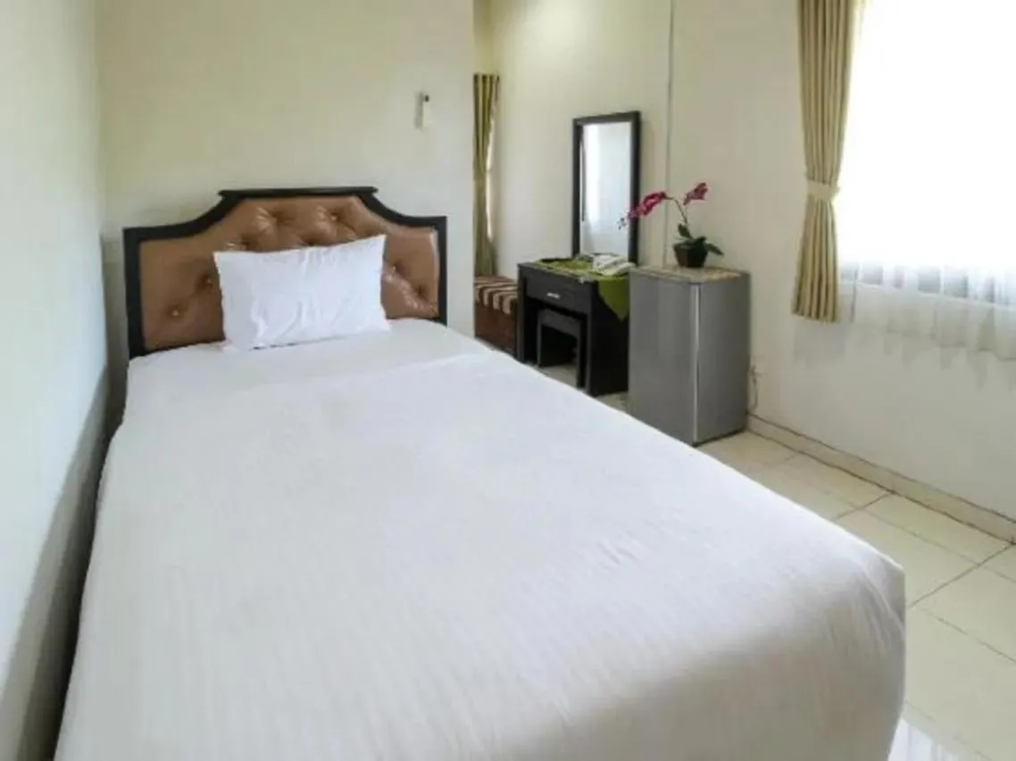 Bed in Tuban Torres Accommodation