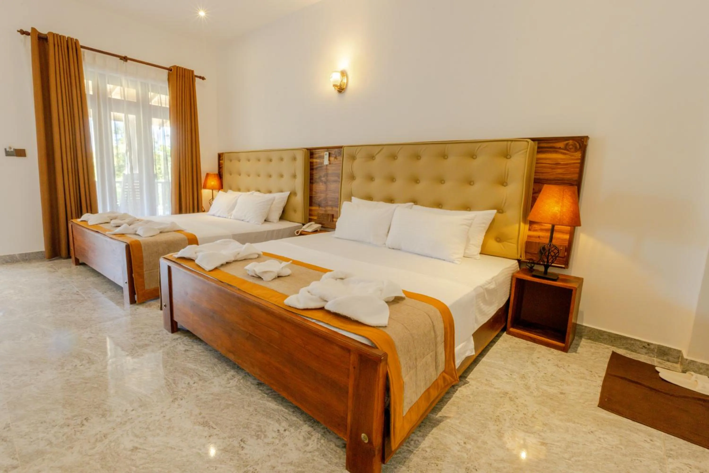 Bed in Elysia Sigiriya Hotel