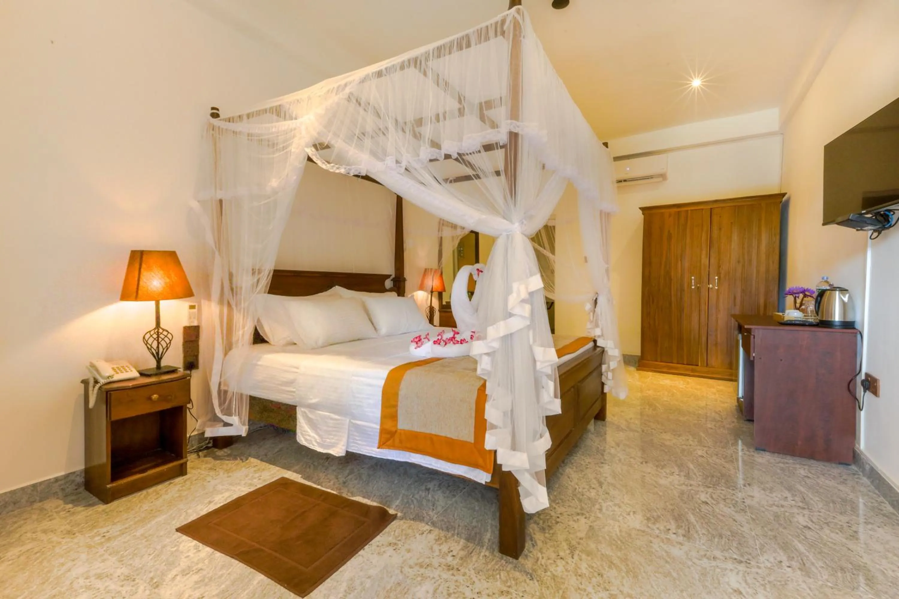 Bed in Elysia Sigiriya Hotel