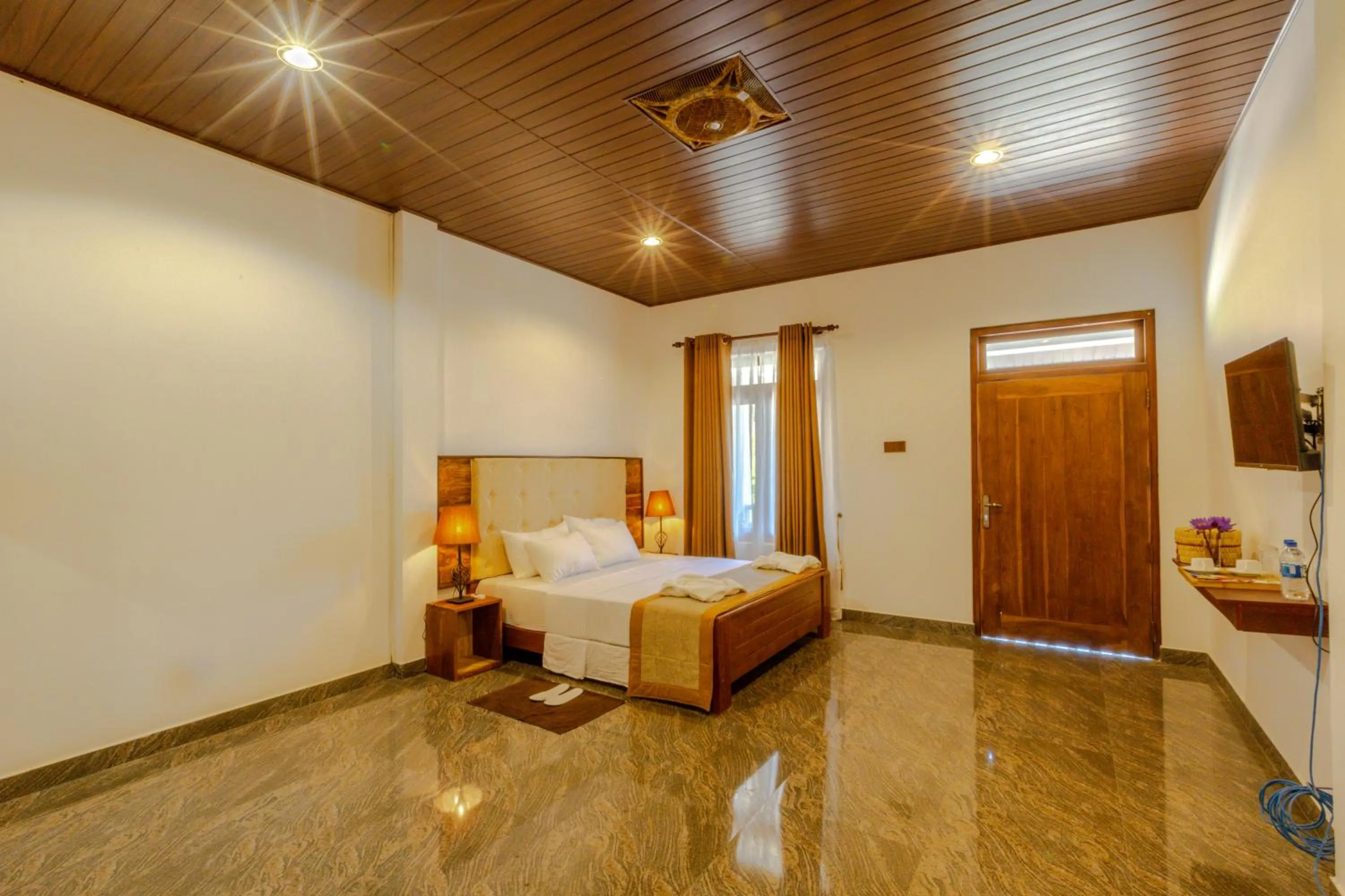 Bed in Elysia Sigiriya Hotel