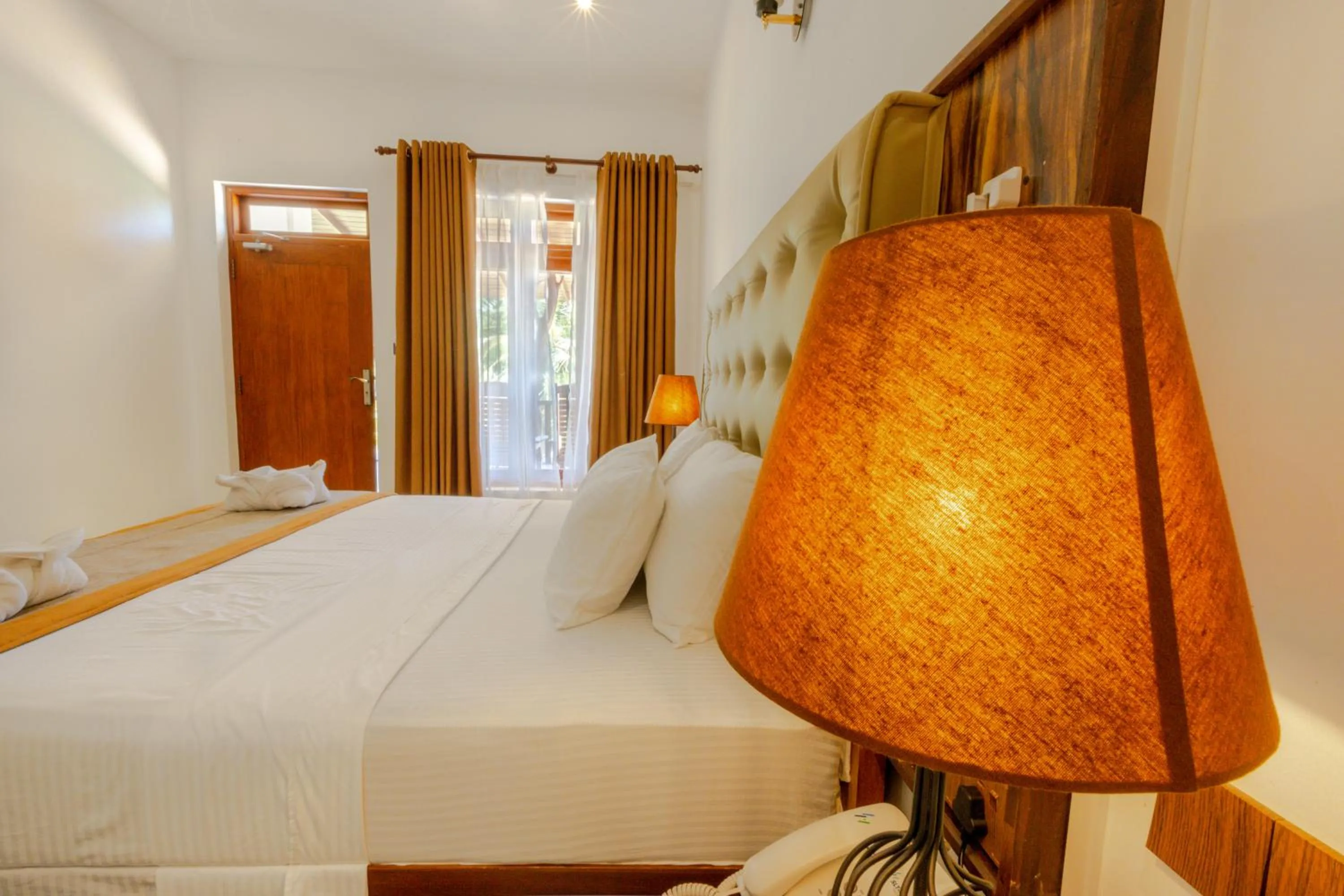 Bed in Elysia Sigiriya Hotel