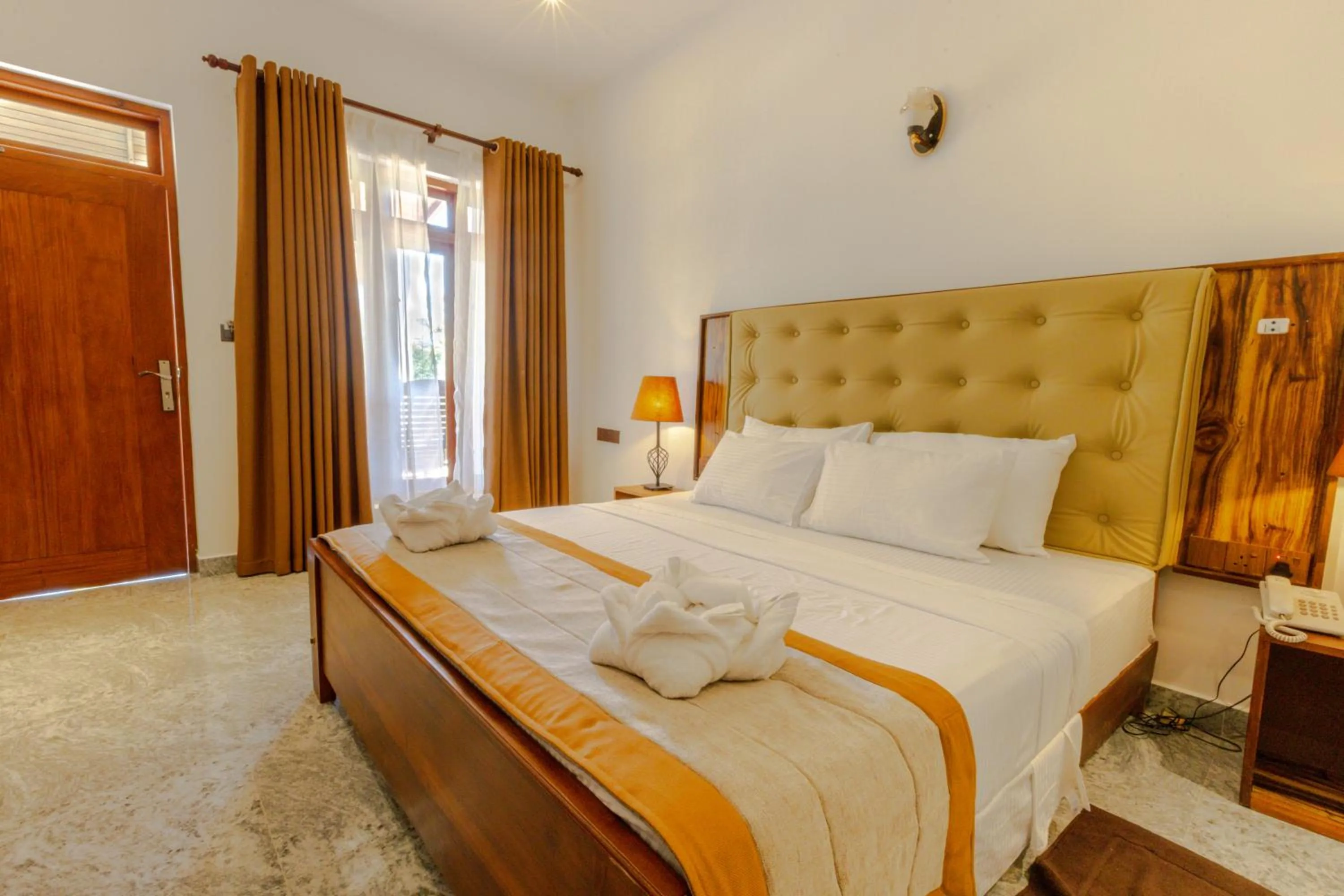 Bed in Elysia Sigiriya Hotel