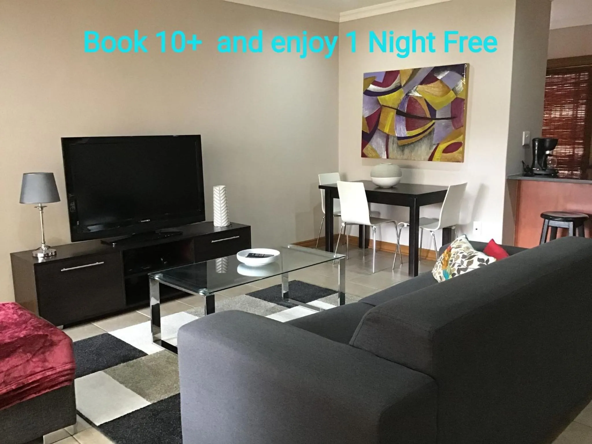 Communal lounge/ TV room in Cozy 2BR 2BR Townhouse Netflix Private Parking Great Location