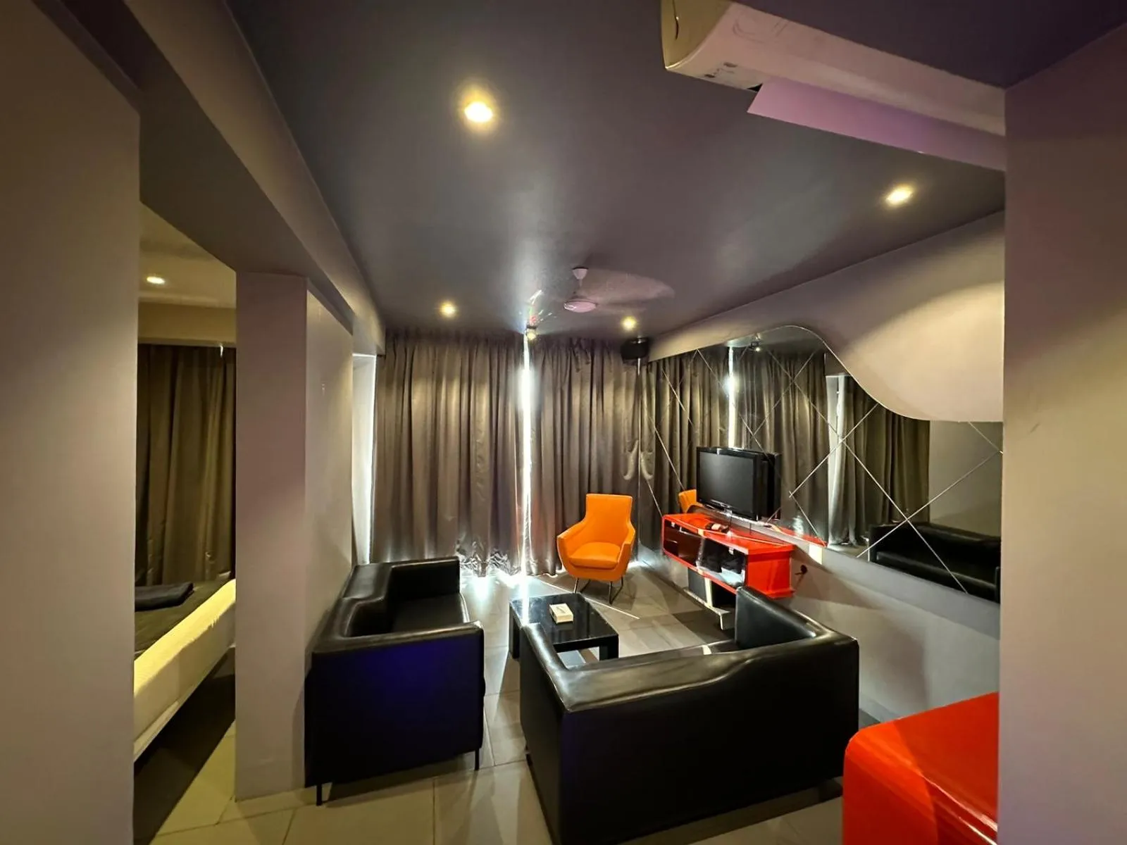 Living room in SinQ Party Hotel - No Male Stags Allowed