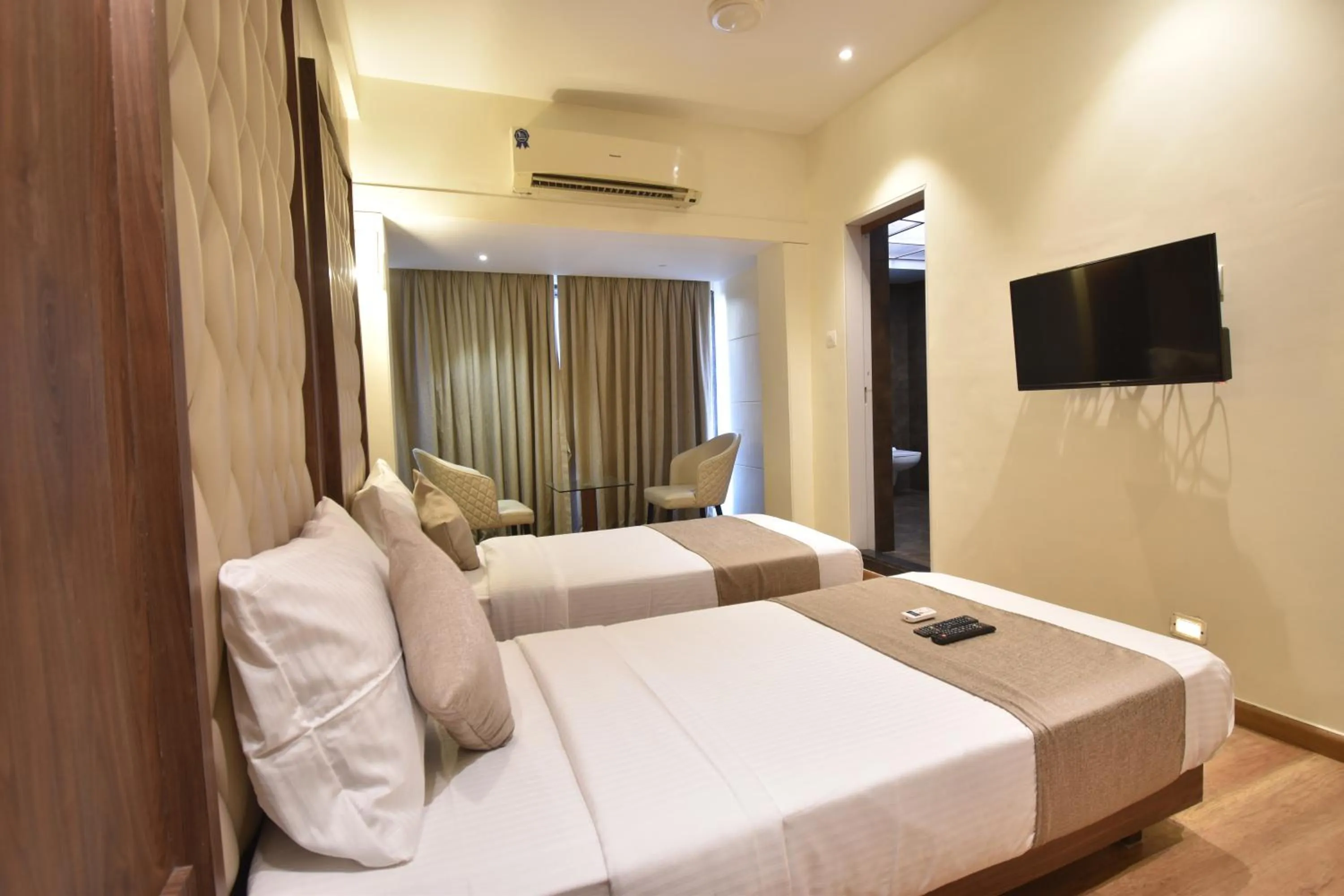 Photo of the whole room, Bed in The Aarya A Smart Business Hotel