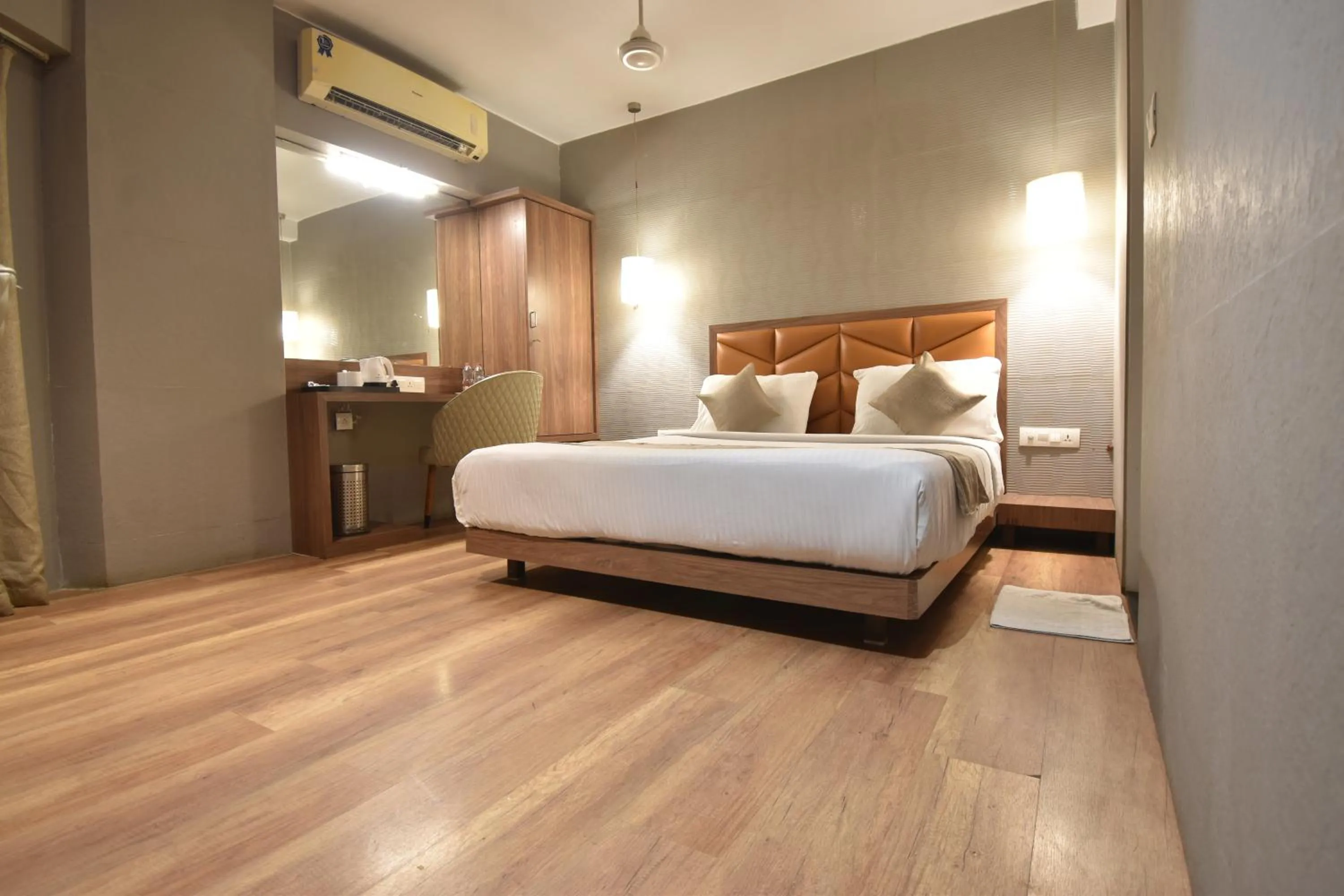 Photo of the whole room, Bed in The Aarya A Smart Business Hotel