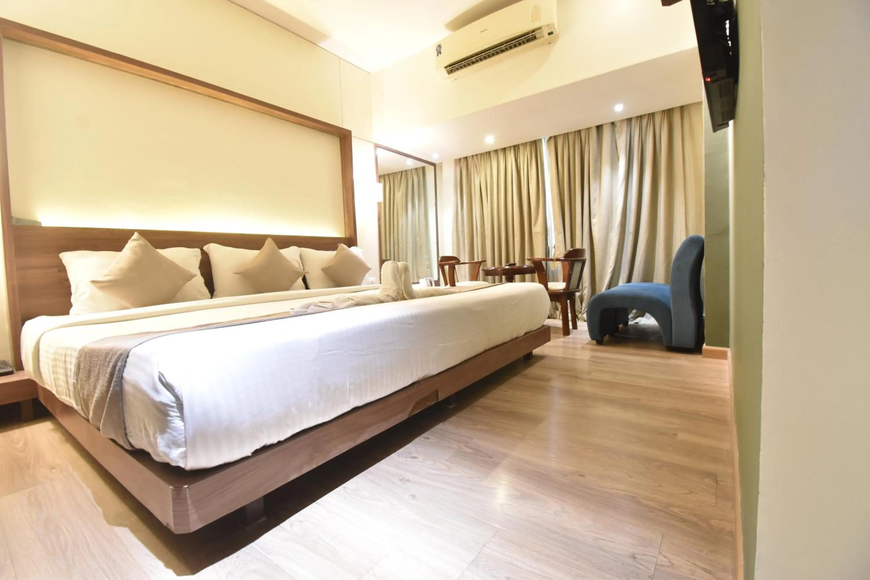 Bed in The Aarya A Smart Business Hotel