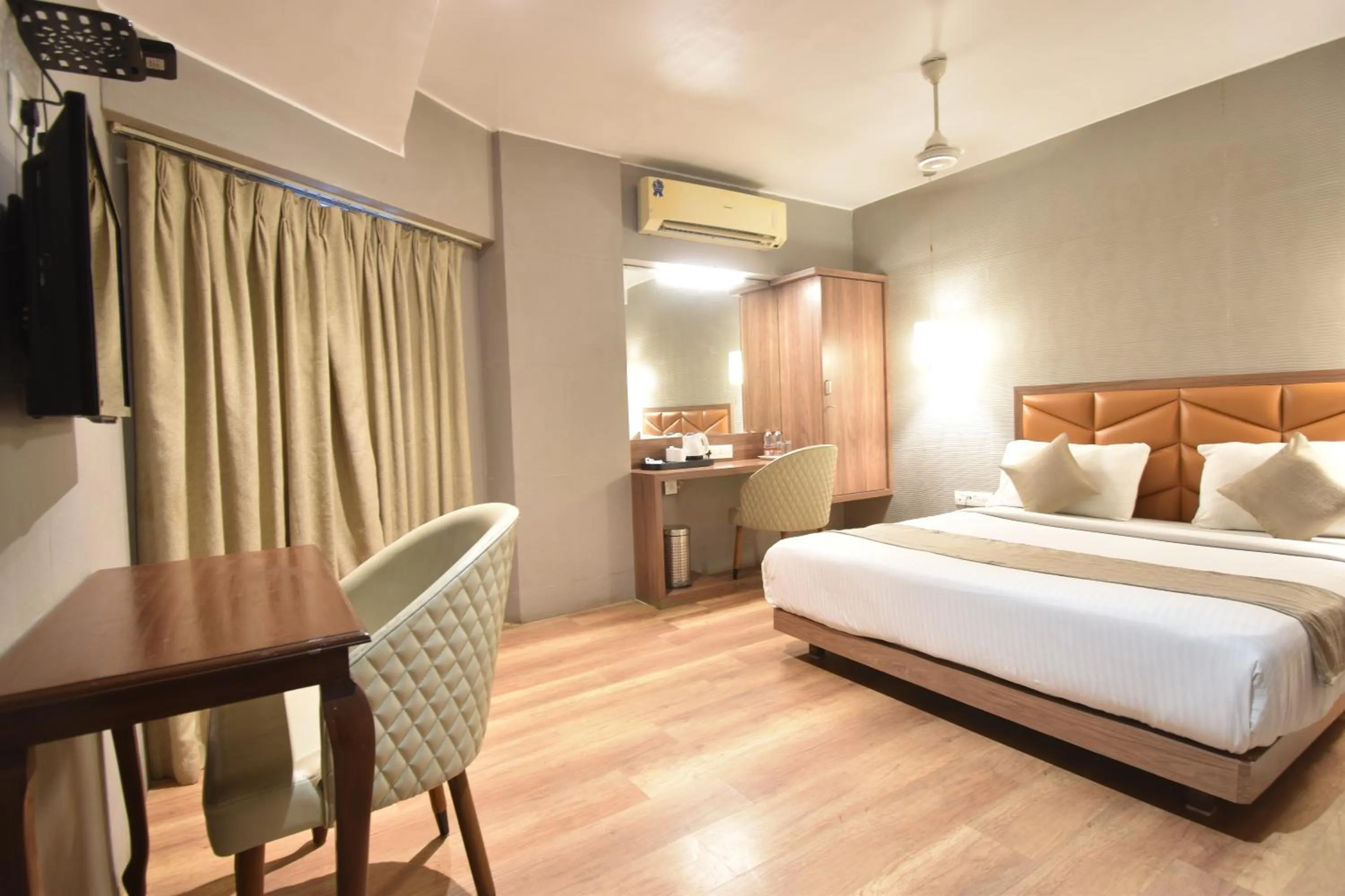 Bed in The Aarya A Smart Business Hotel