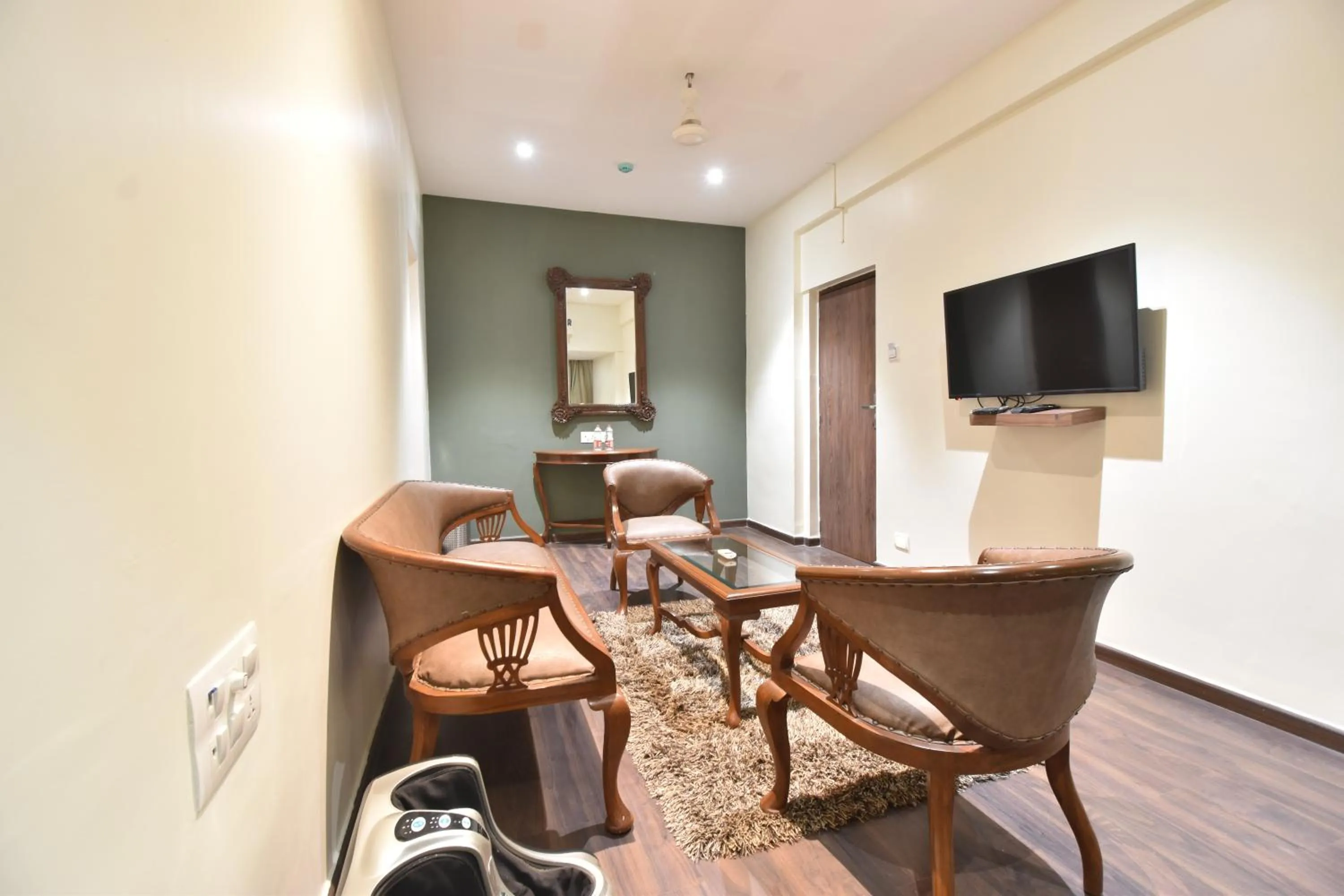 Communal lounge/ TV room in The Aarya A Smart Business Hotel