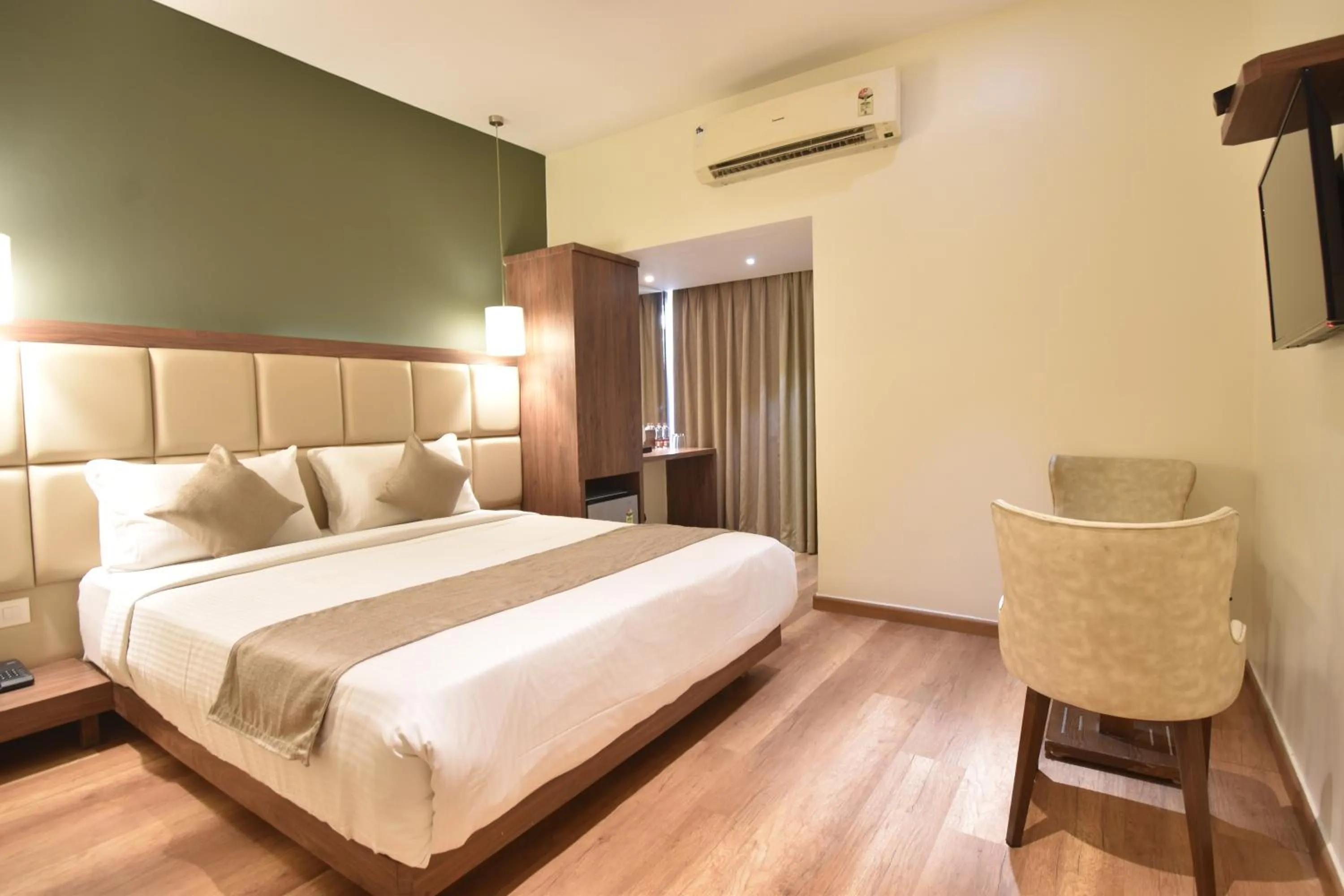 Photo of the whole room, Bed in The Aarya A Smart Business Hotel