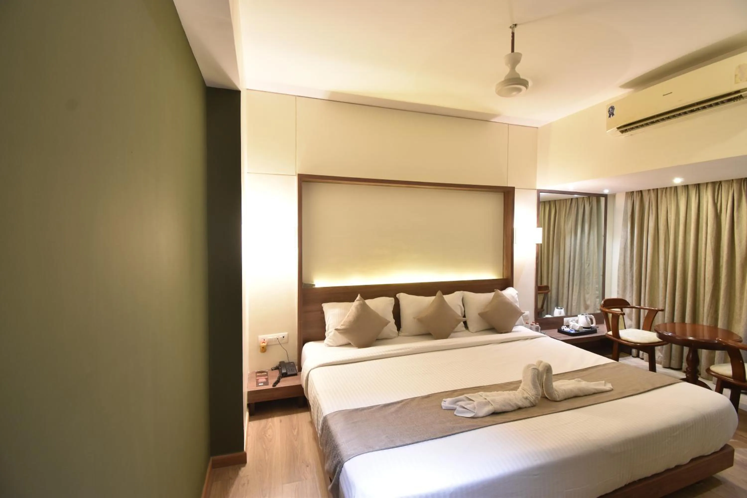 Bed in The Aarya A Smart Business Hotel
