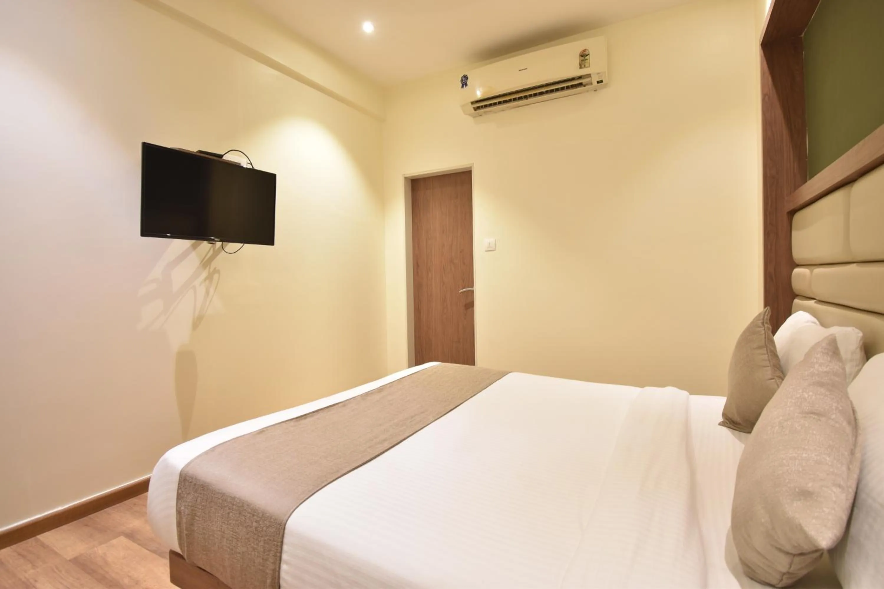 Bed in The Aarya A Smart Business Hotel
