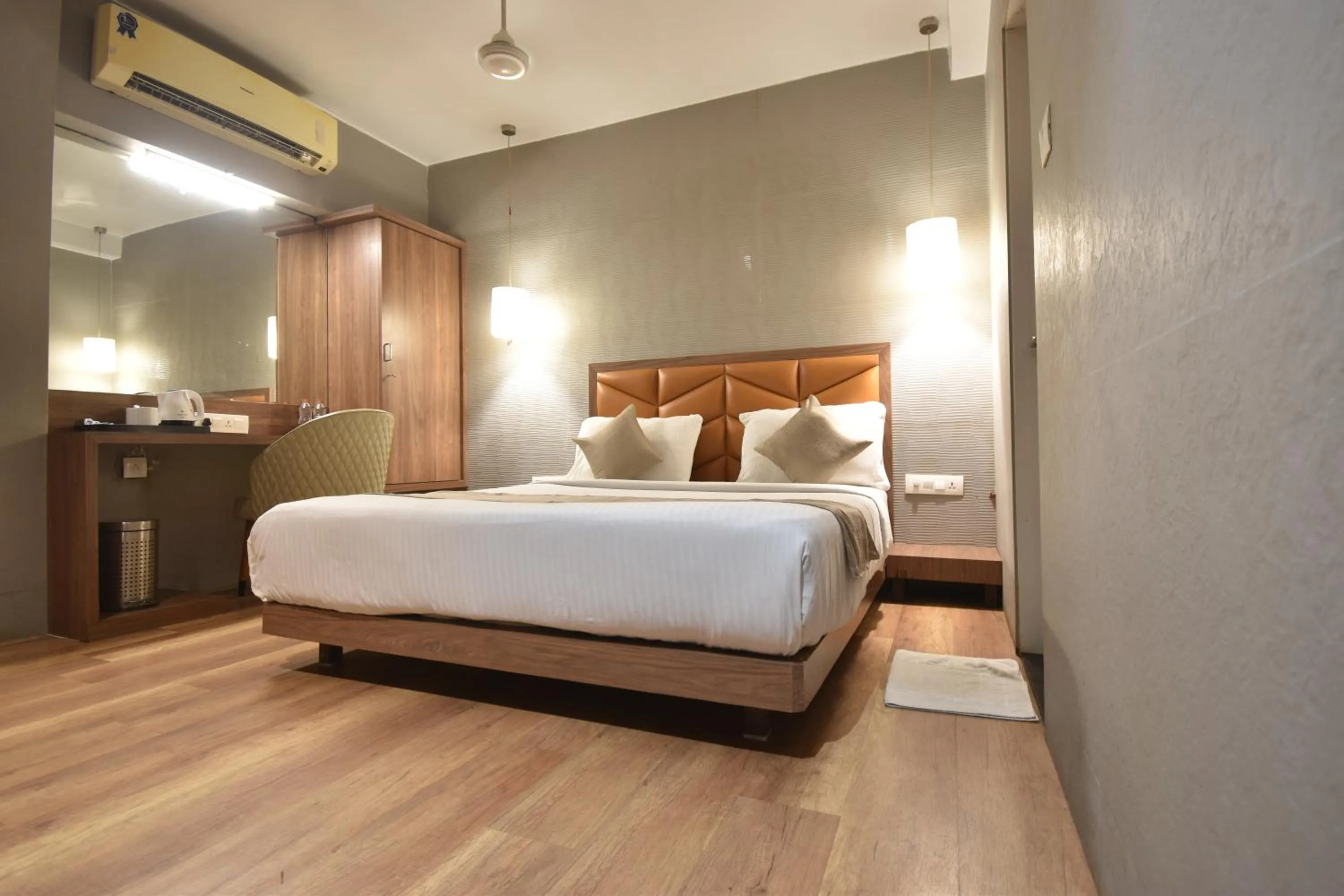 air conditioner, Bed in The Aarya A Smart Business Hotel
