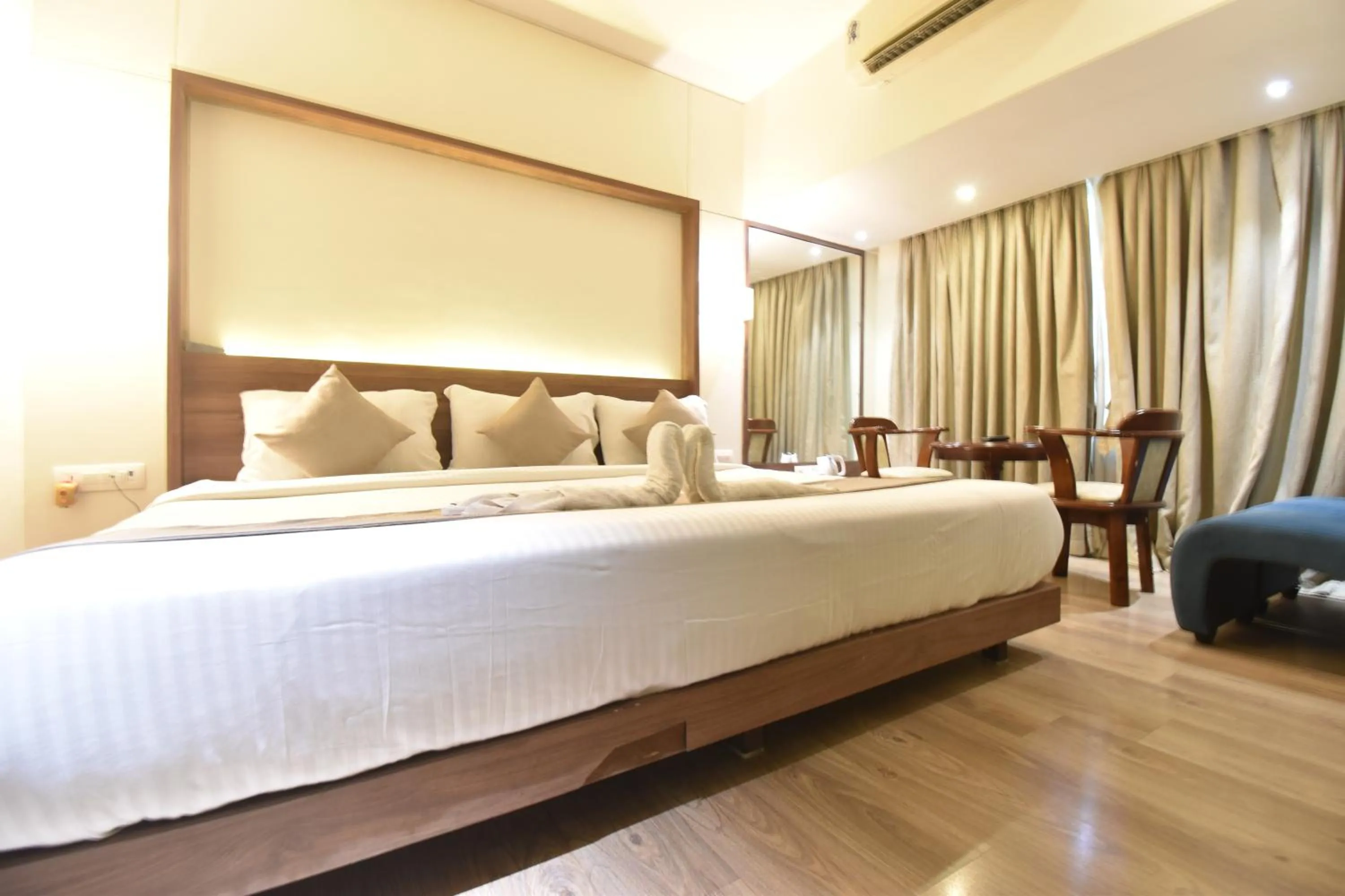 Bed in The Aarya A Smart Business Hotel