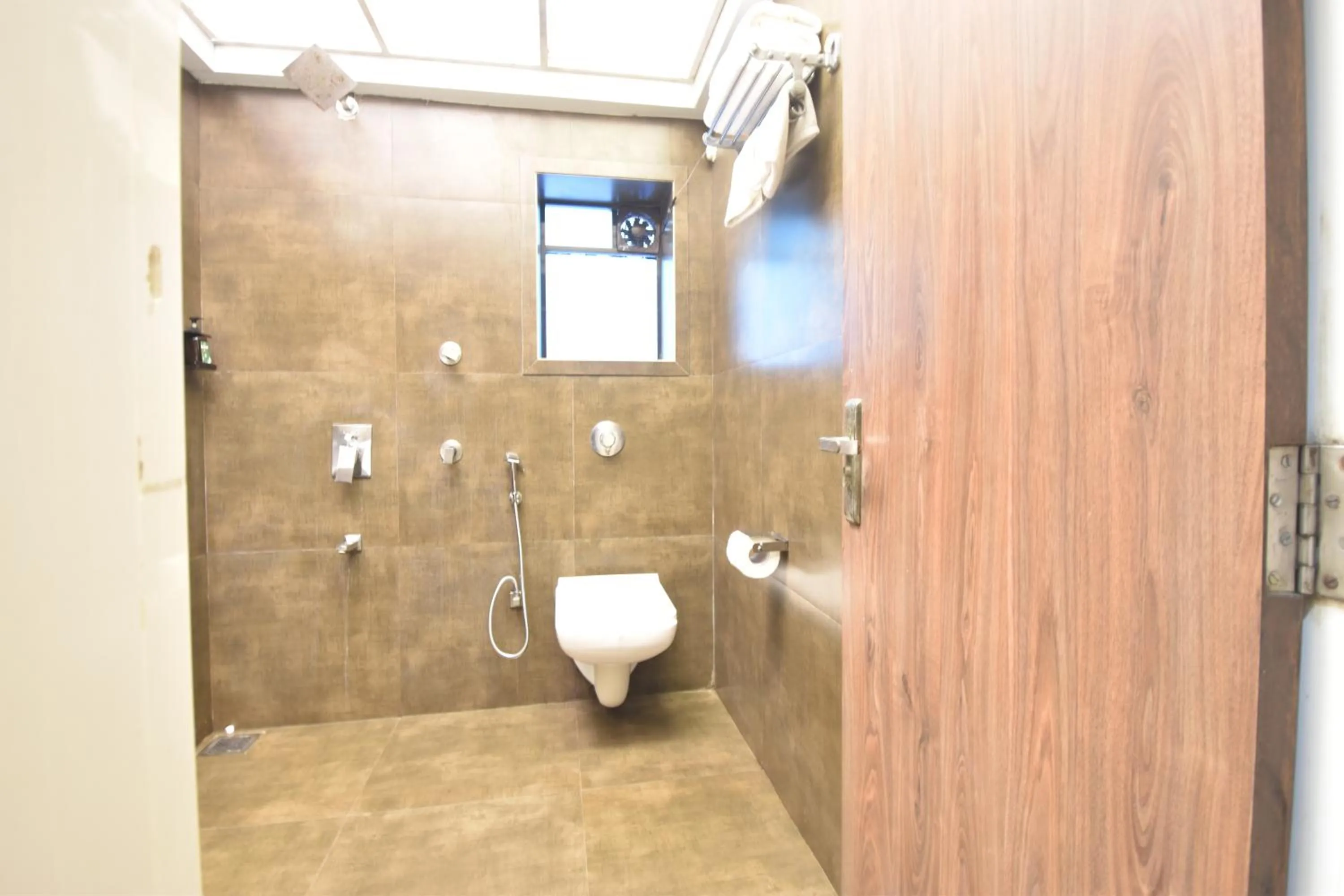 Toilet in The Aarya A Smart Business Hotel