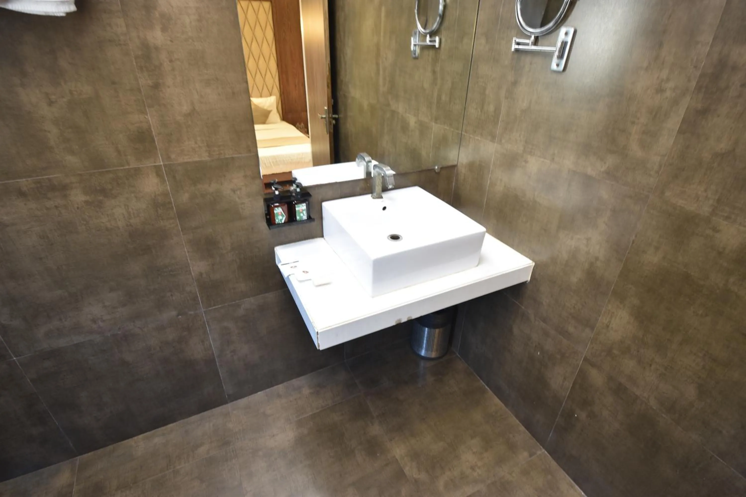 Bathroom in The Aarya A Smart Business Hotel