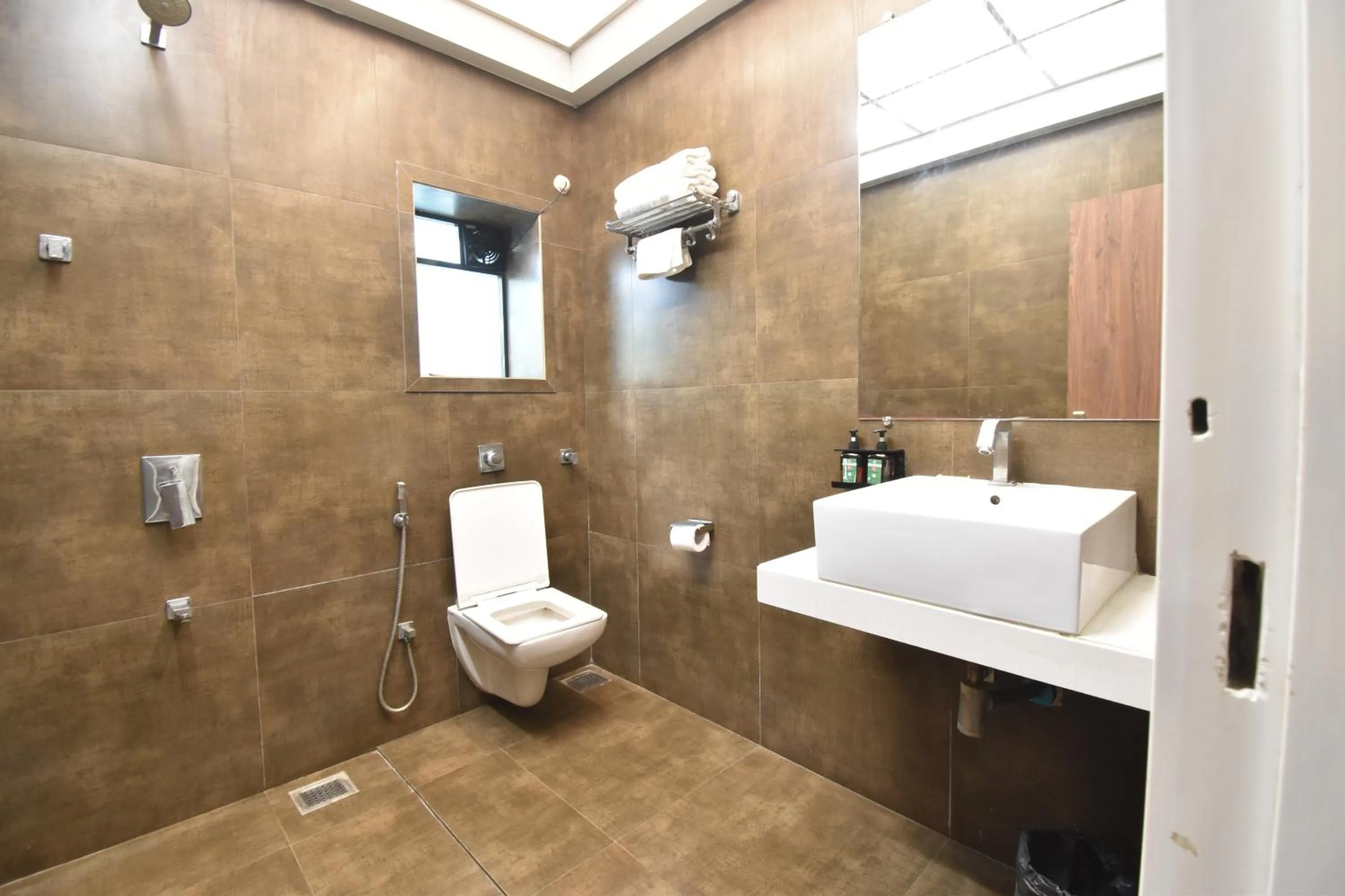 Toilet in The Aarya A Smart Business Hotel