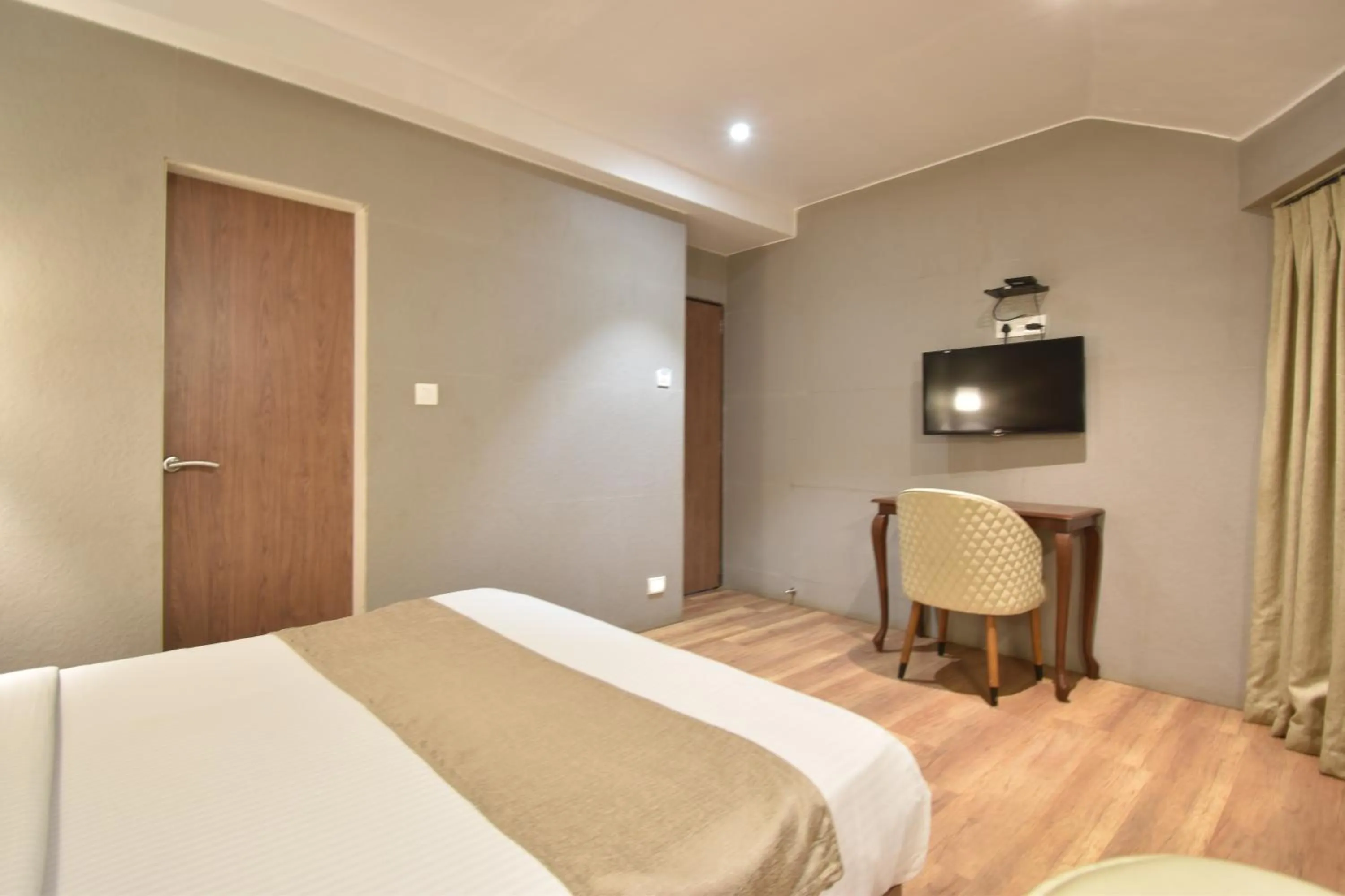 TV and multimedia, Bed in The Aarya A Smart Business Hotel