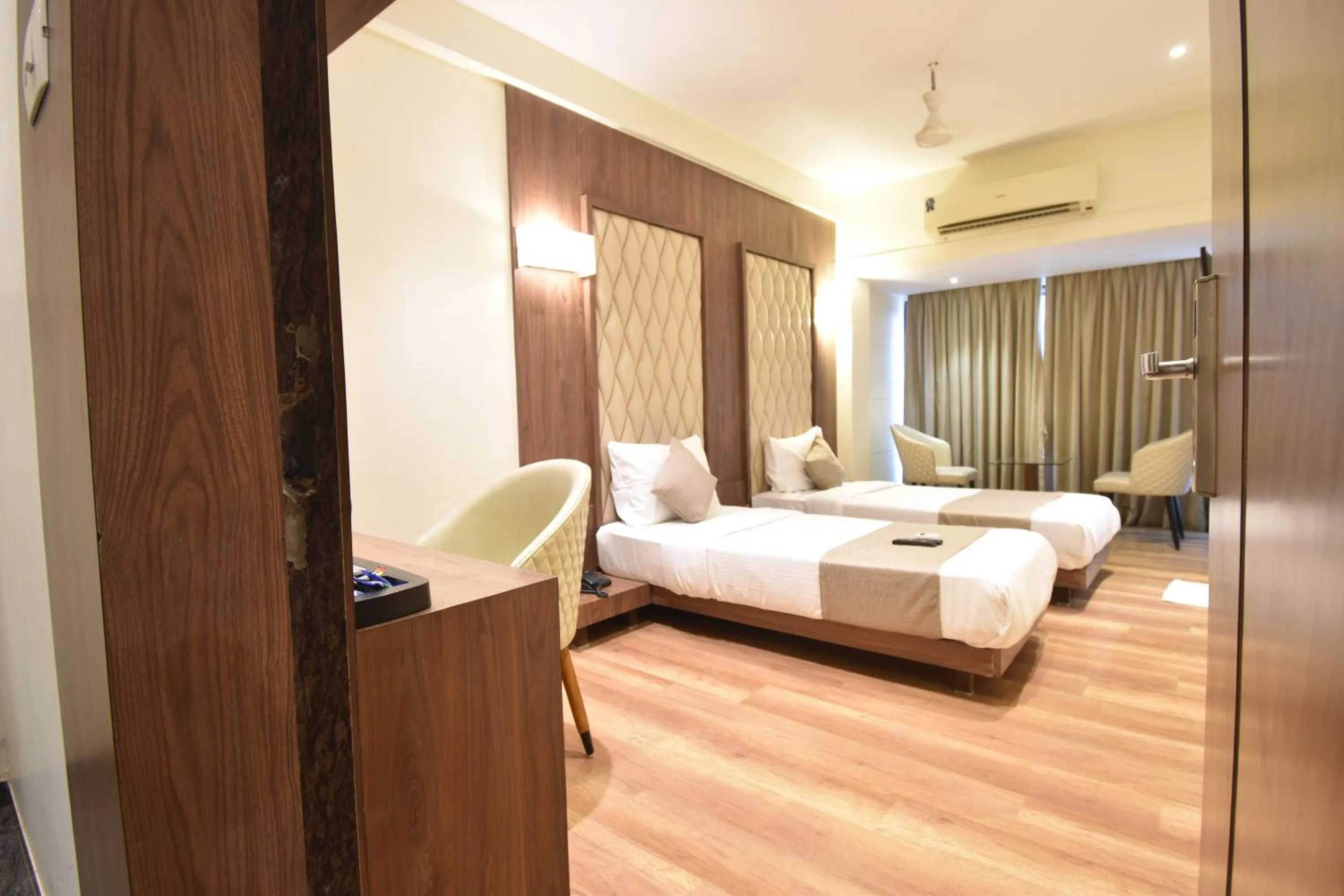Living room, Bed in The Aarya A Smart Business Hotel