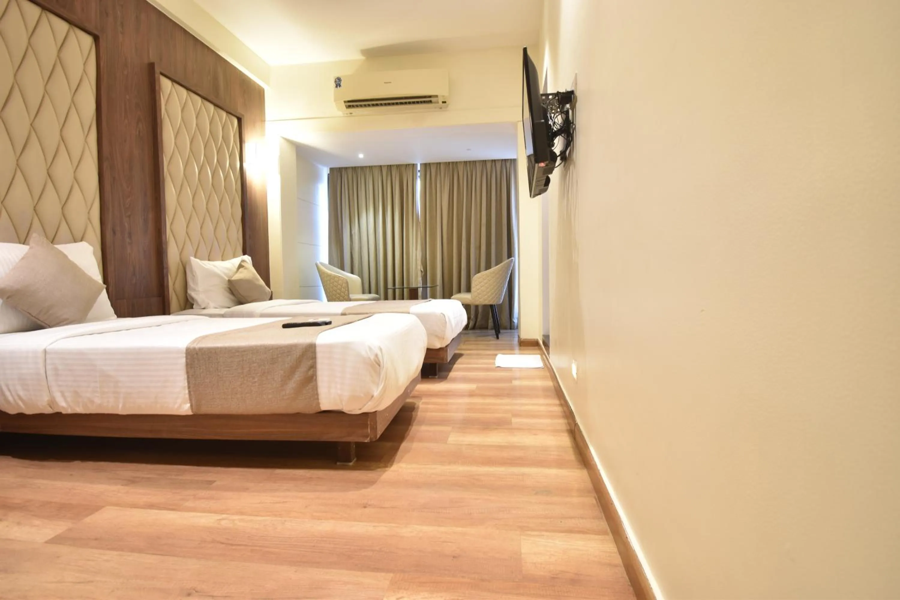 Photo of the whole room, Bed in The Aarya A Smart Business Hotel